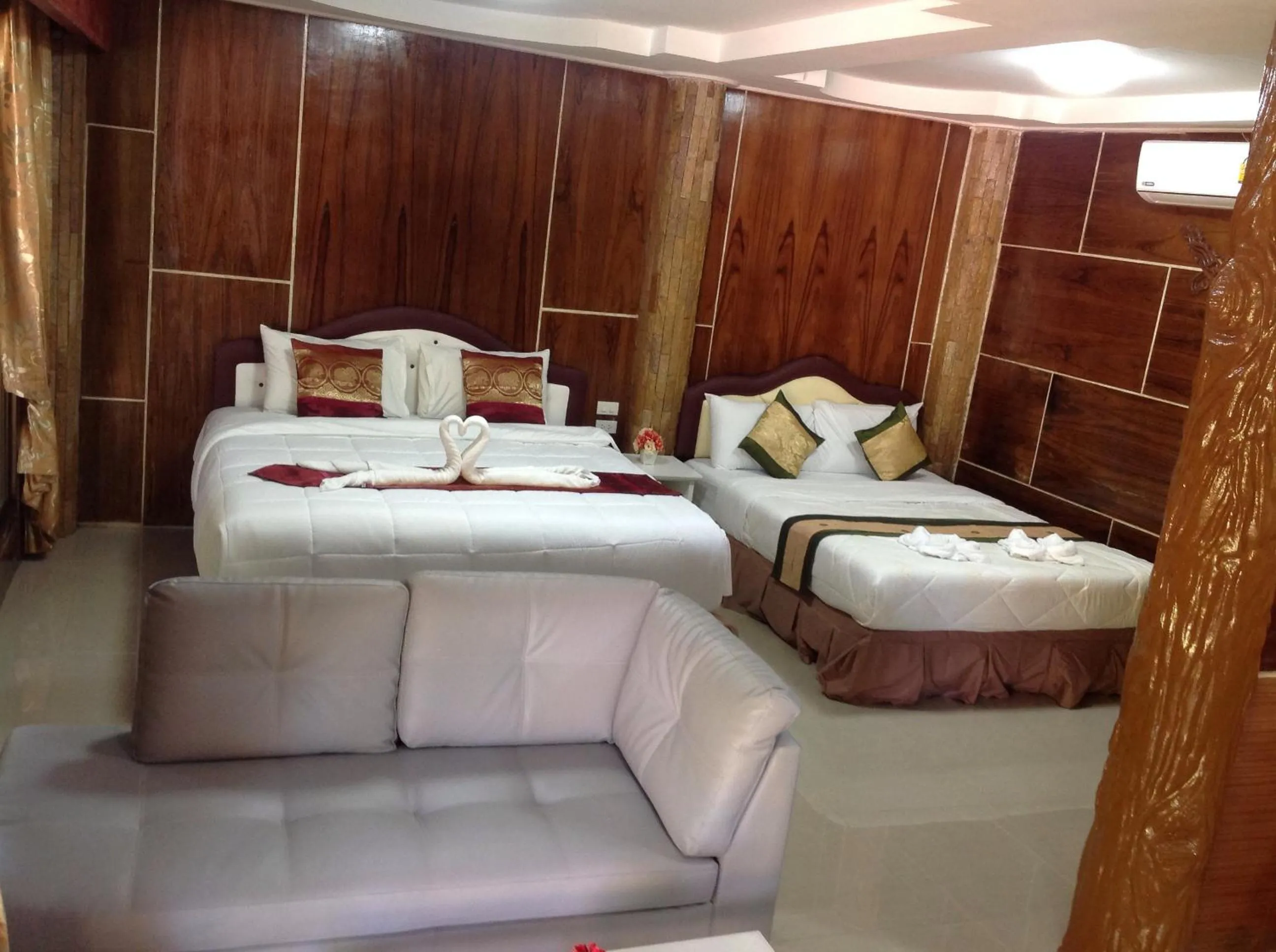 Bed in Ruan Mai Naiyang Beach Resort