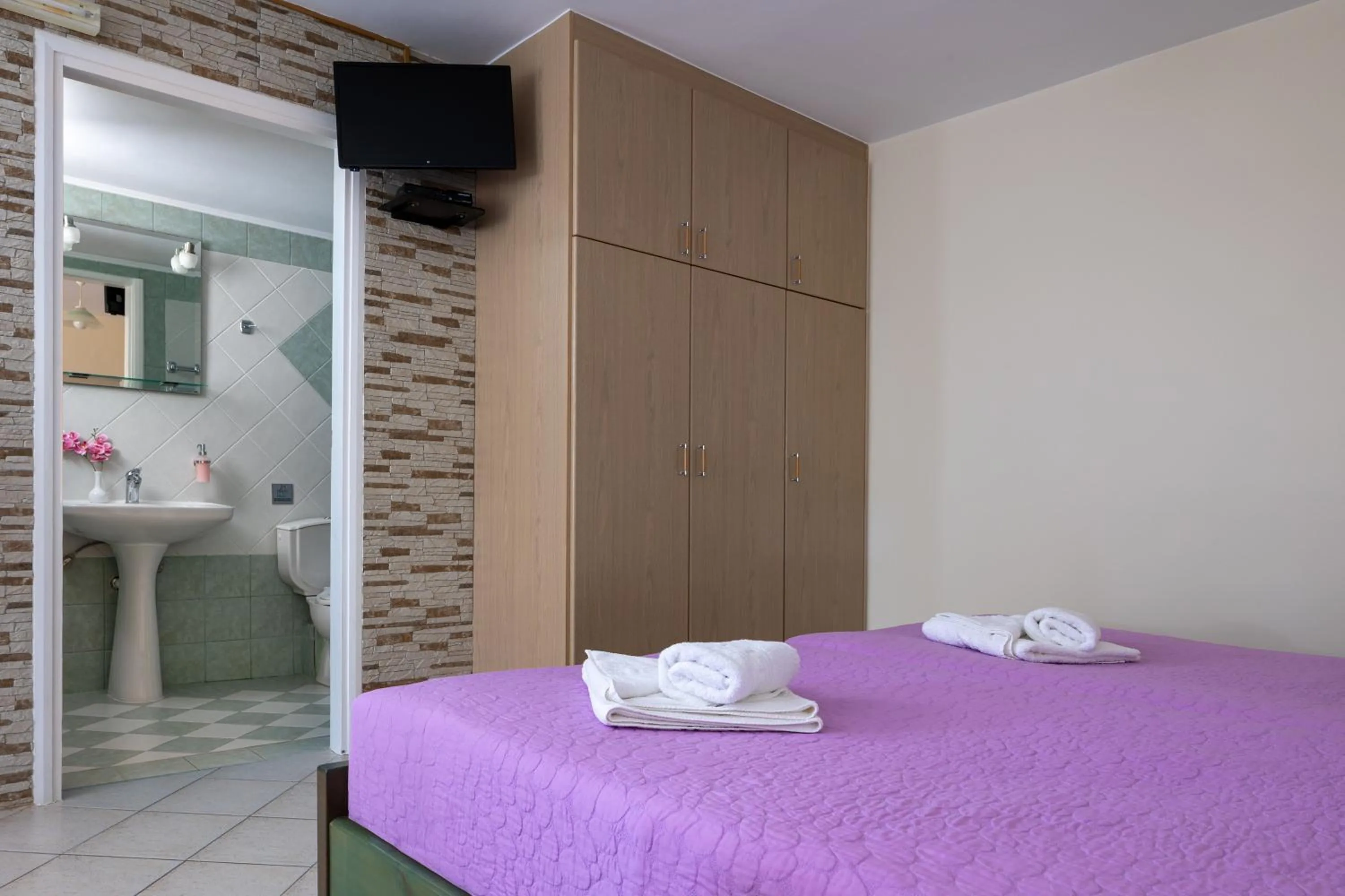 Bed in Armonia Apartments