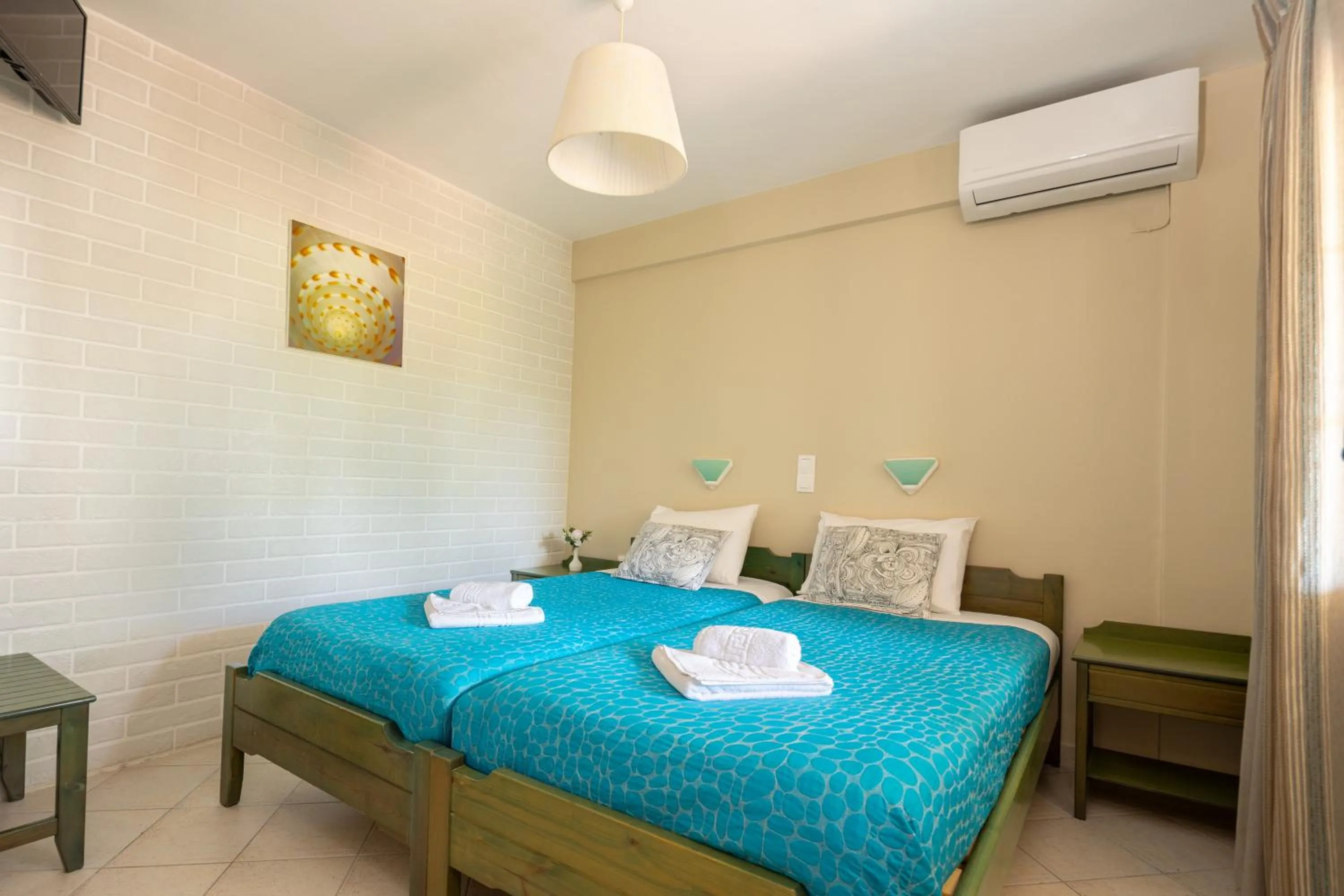 Bed in Armonia Apartments