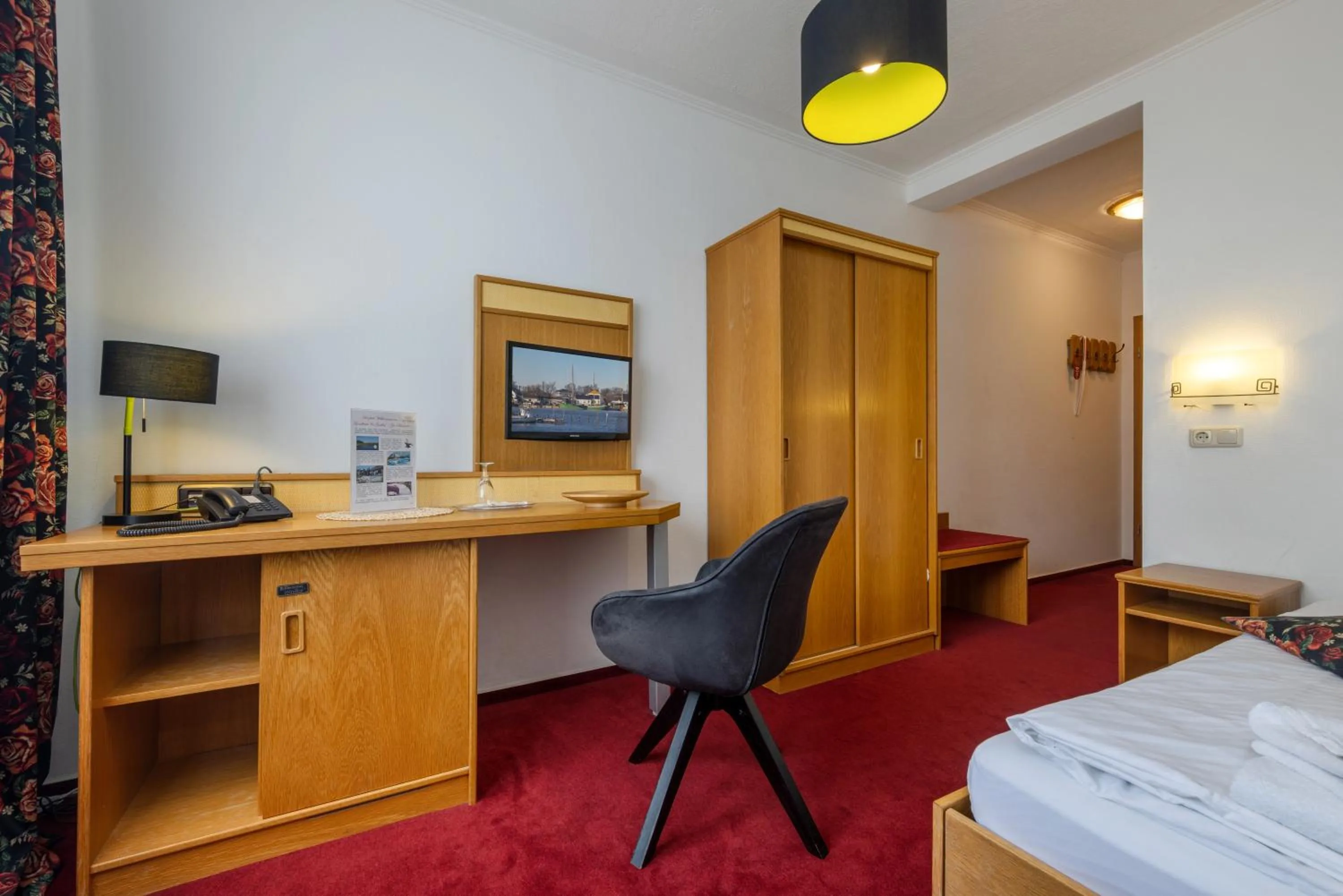 Seating area, Bed in Landhotel Zur Schmiede