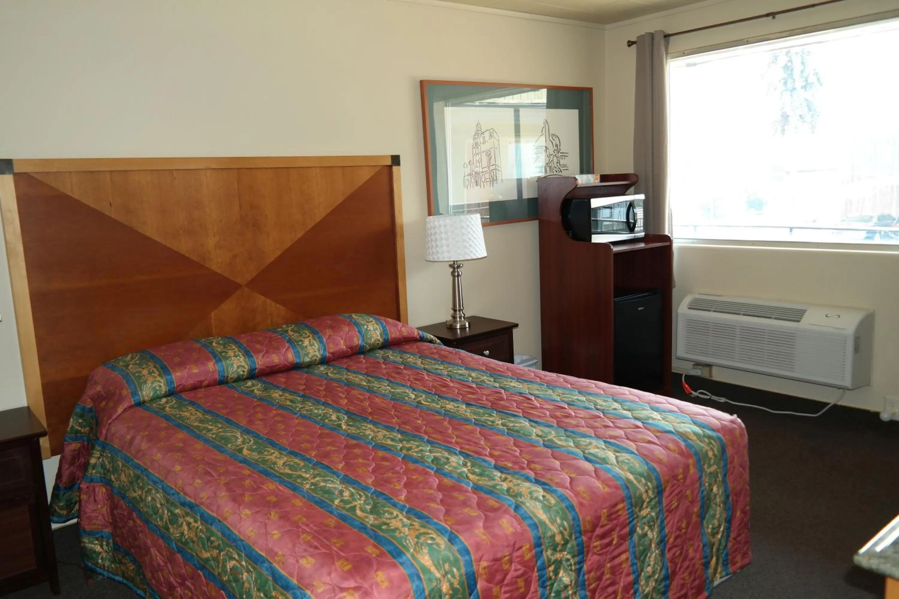 Bed in River Park Inn