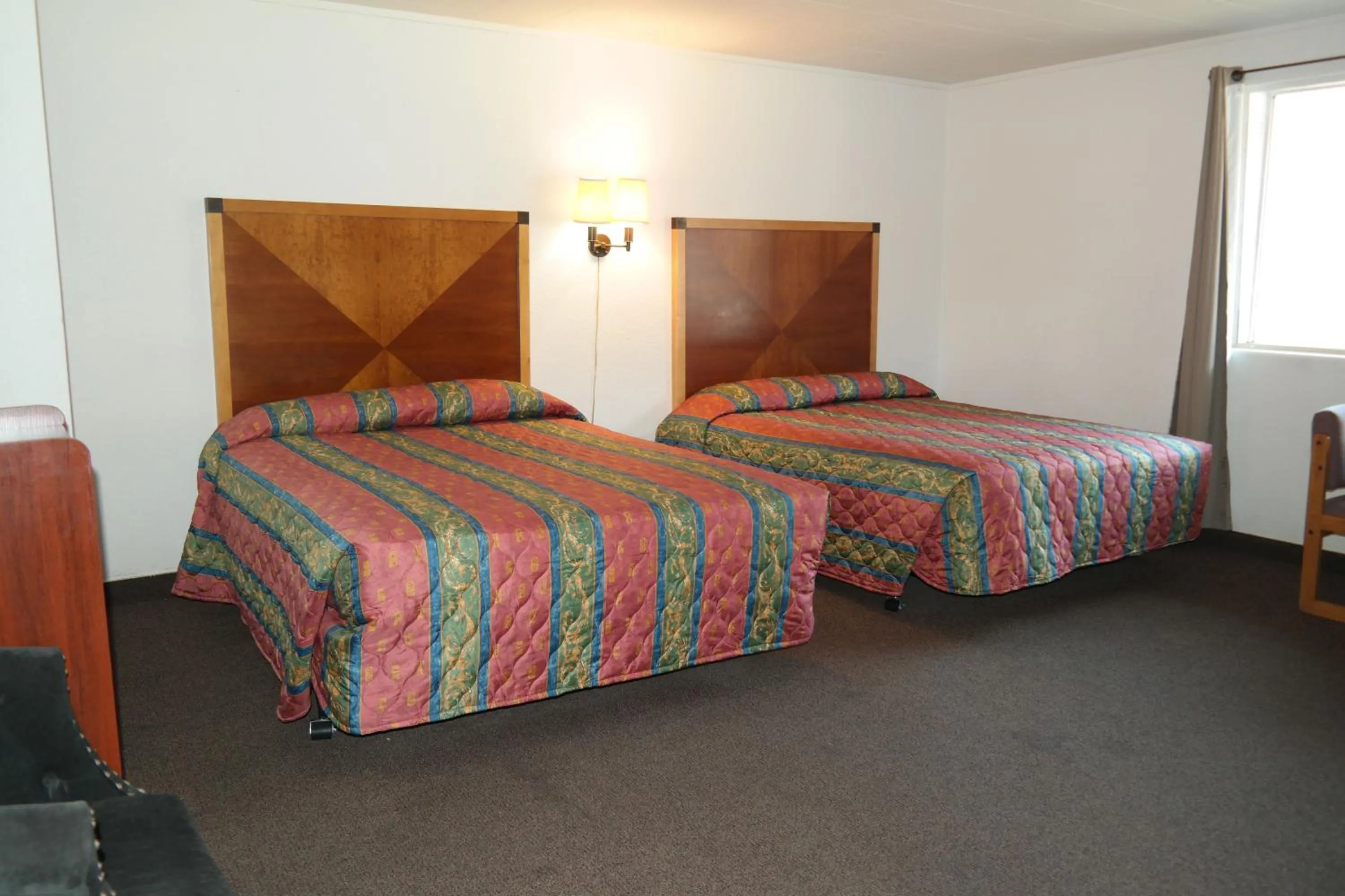 Bed in River Park Inn