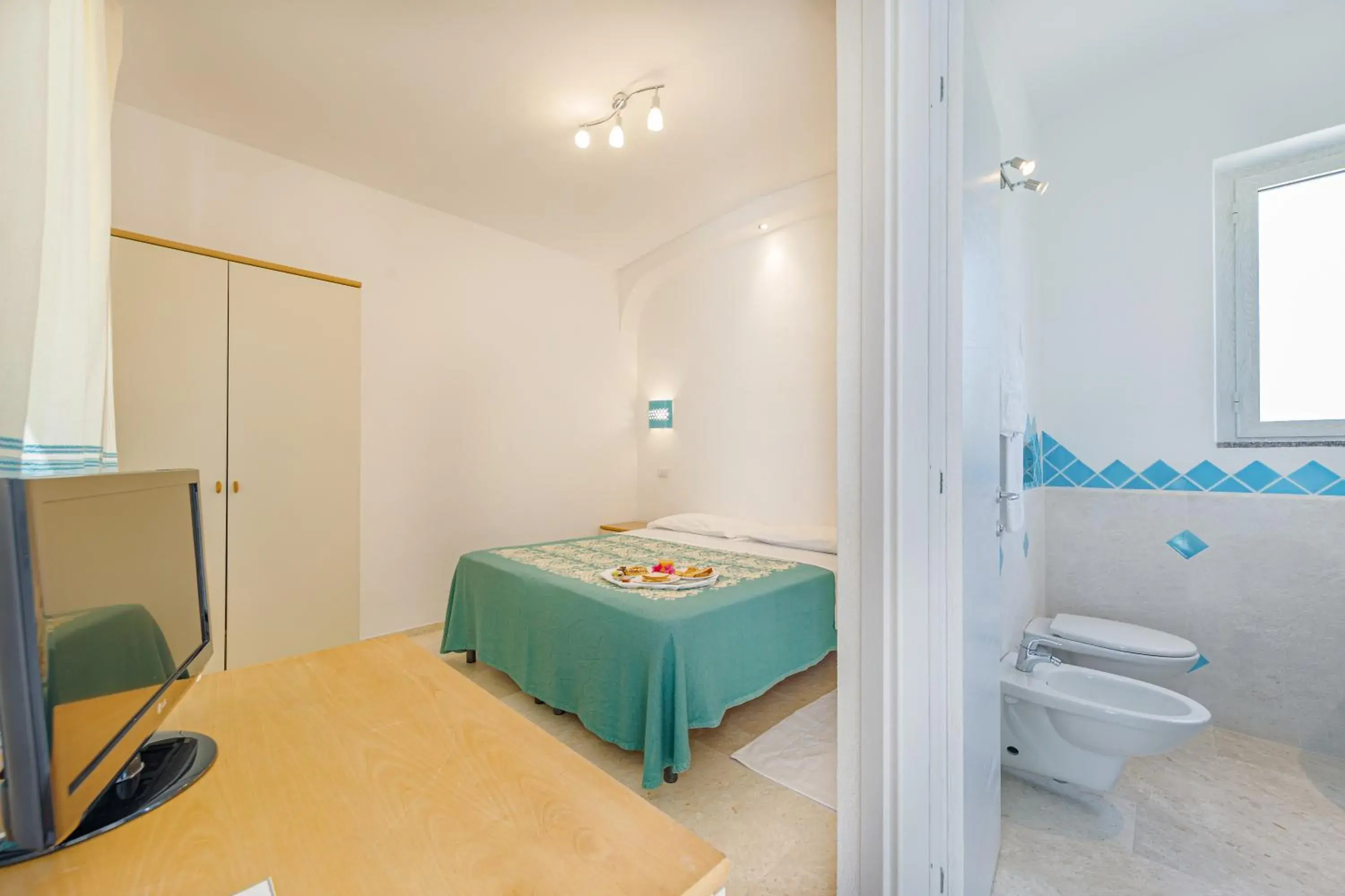 Double or Twin Room with Garden View in Hotel Le Mimose Double or Twin Room with Garden View in Hotel Le Mimose