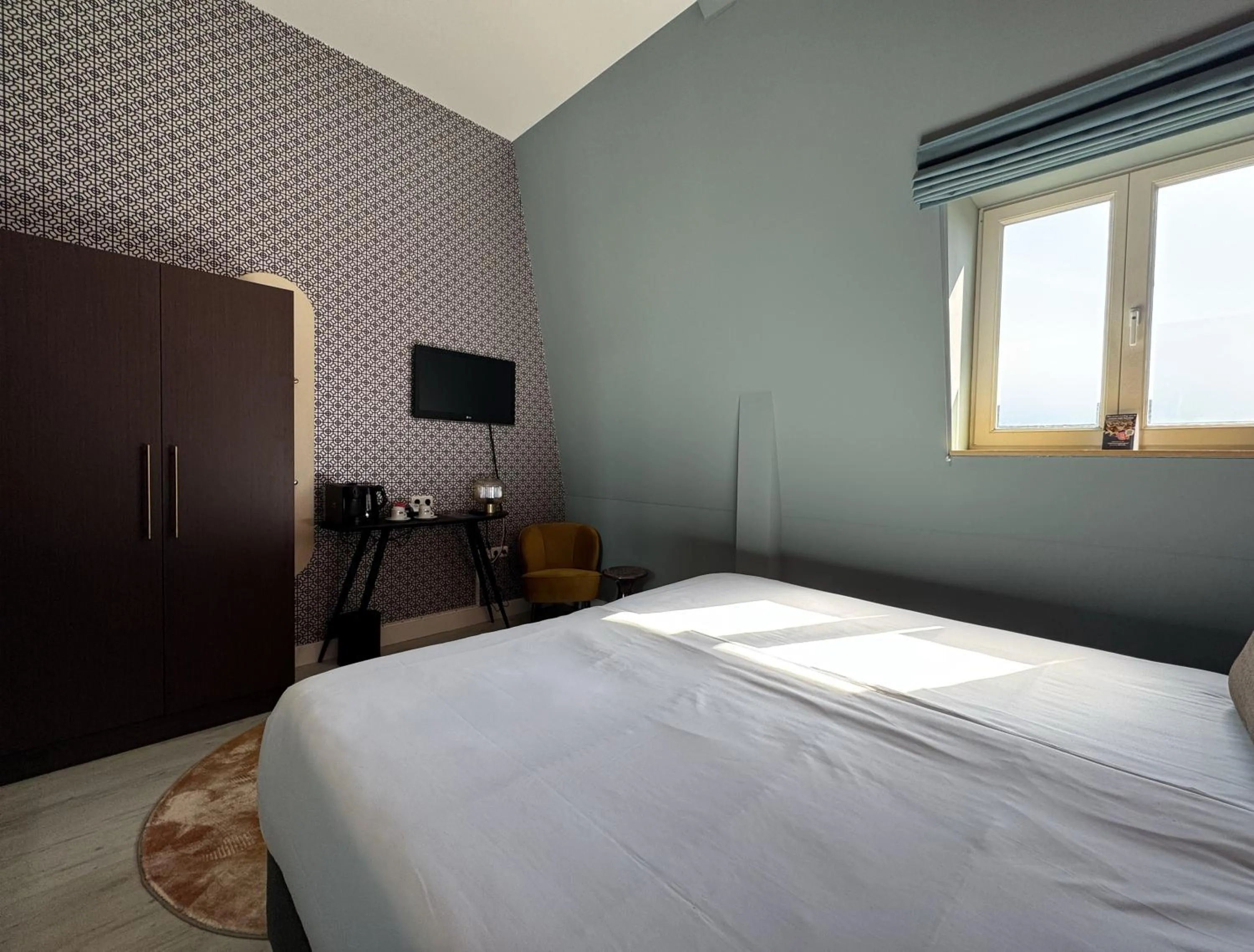 Bed in MERICI Hotel Sittard