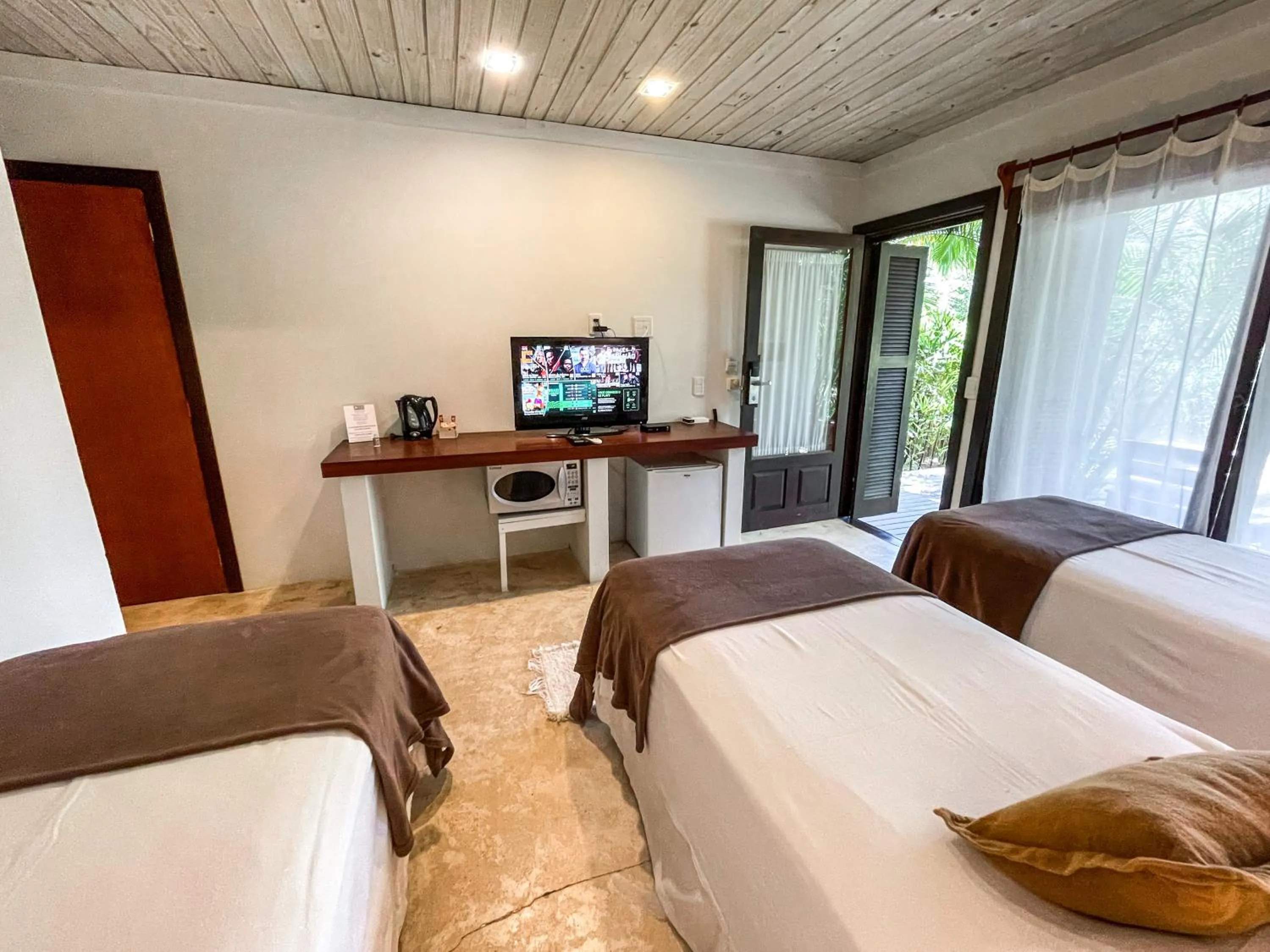 Bed in Morada da Praia do Rosa Pousada