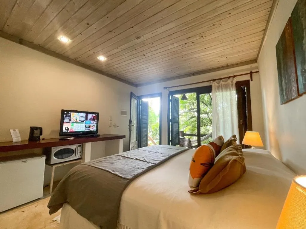 Bed in Morada da Praia do Rosa Pousada