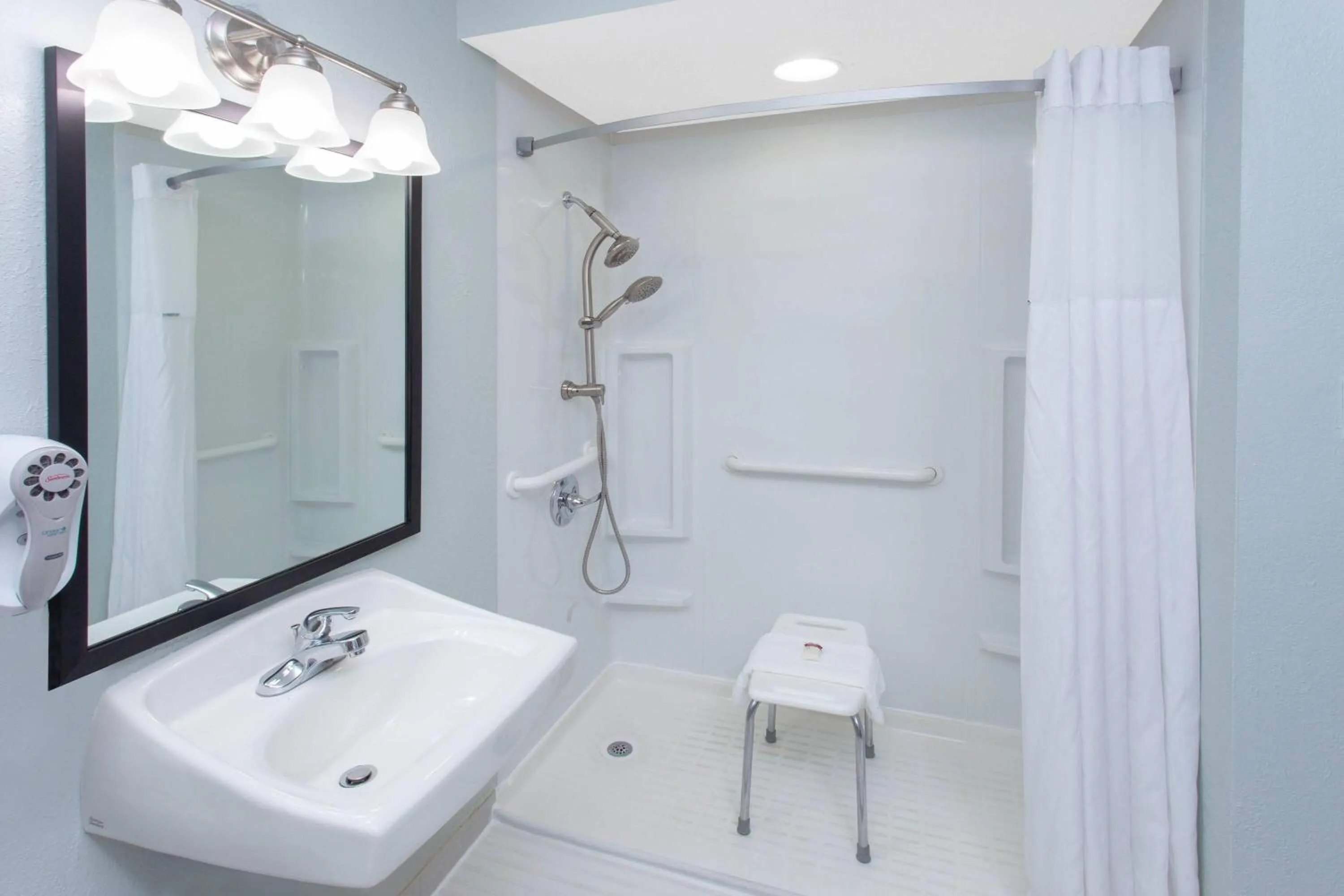 Shower in Baymont by Wyndham Grand Haven