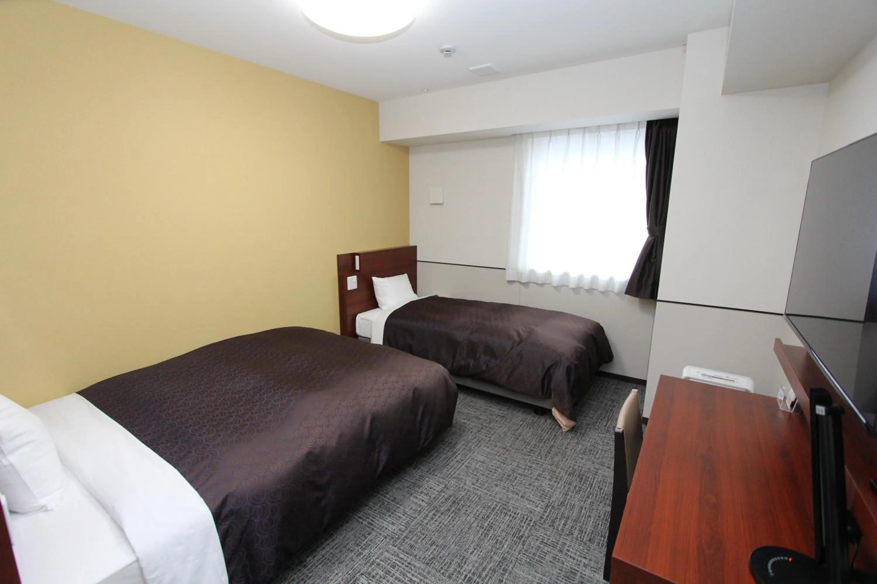 Bed in Hotel 1-2-3 Fukuyama