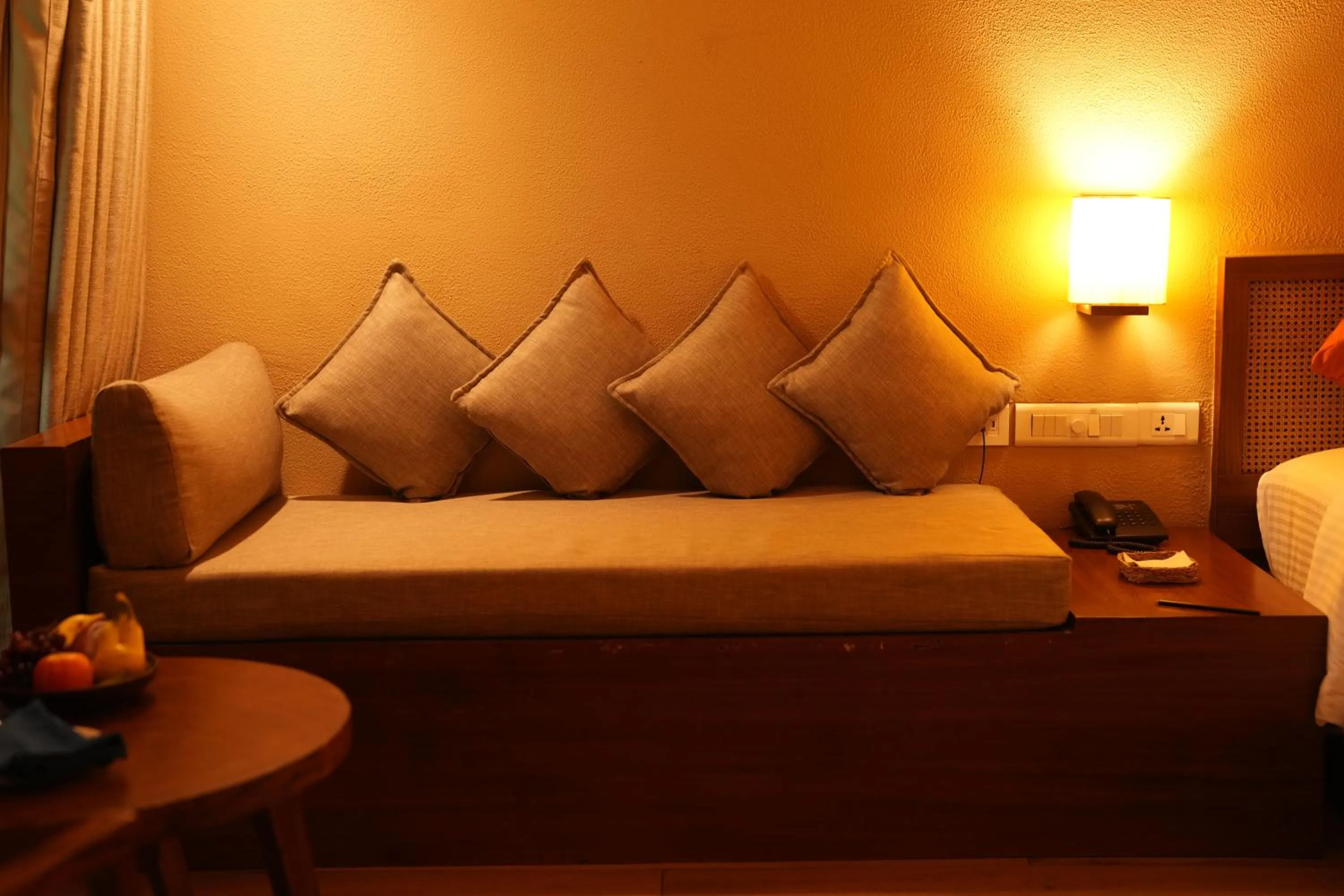 Seating area, Bed in Cardamom County by Xandari