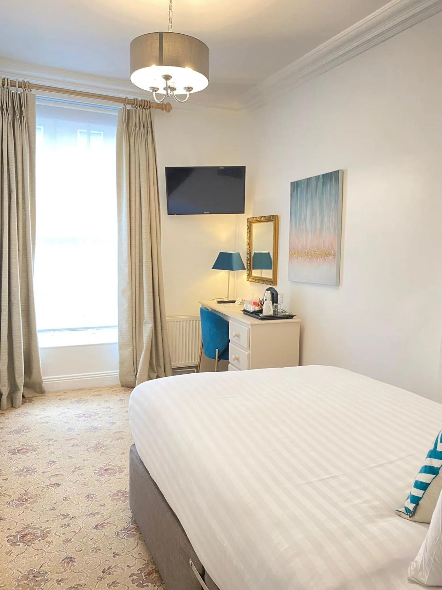 Bed in Tom Dick and Harriet's Accommodation