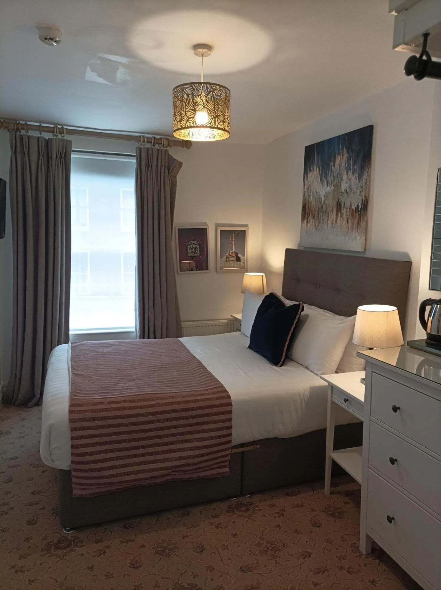 Bed in Tom Dick and Harriet's Accommodation