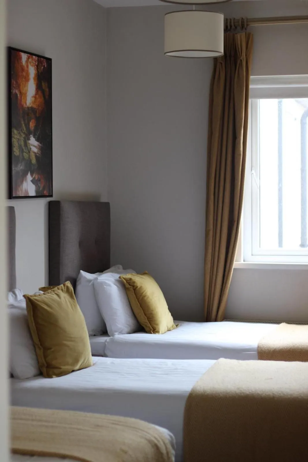 Bed in Tom Dick and Harriet's Accommodation