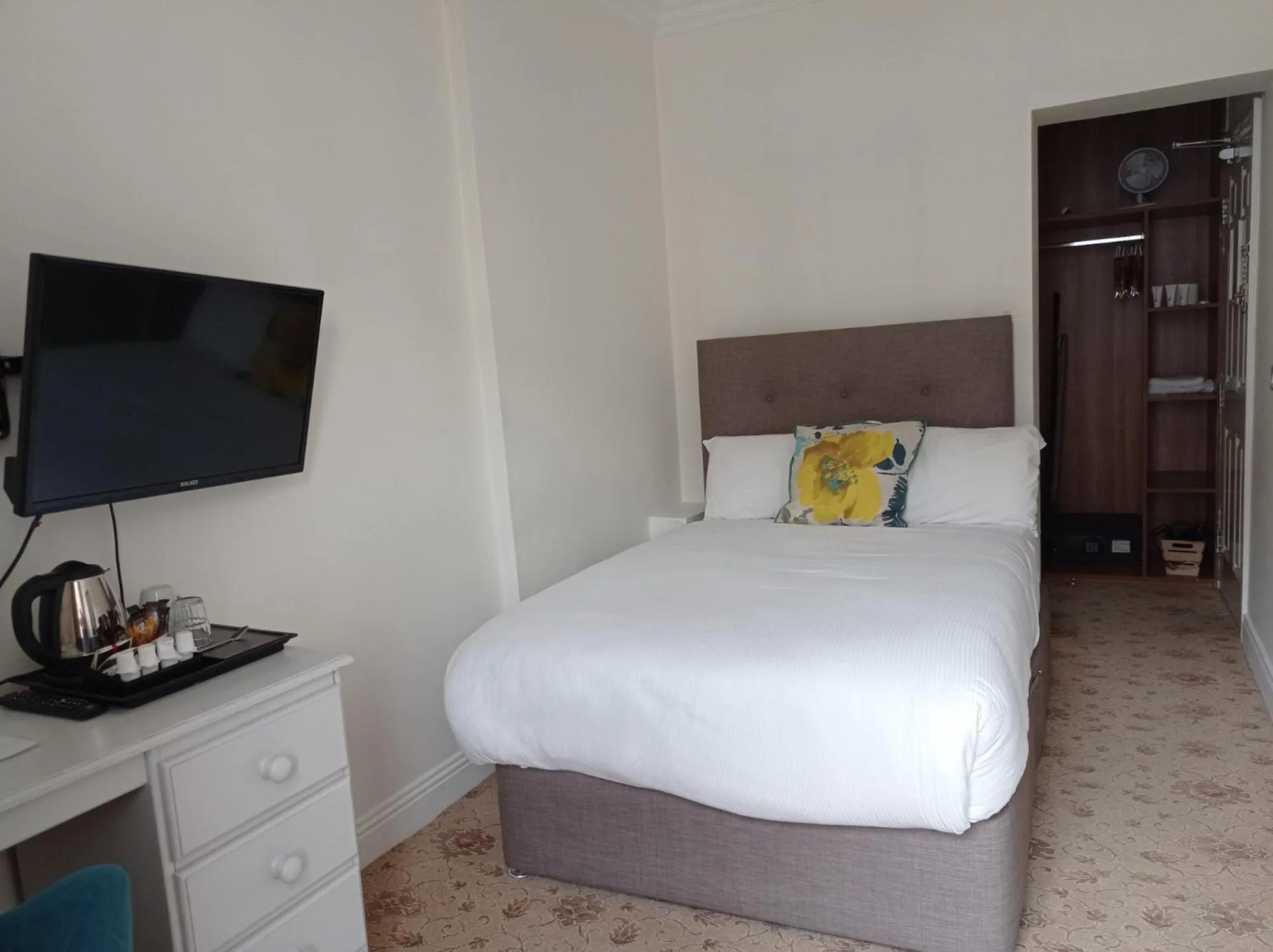 Bed in Tom Dick and Harriet's Accommodation