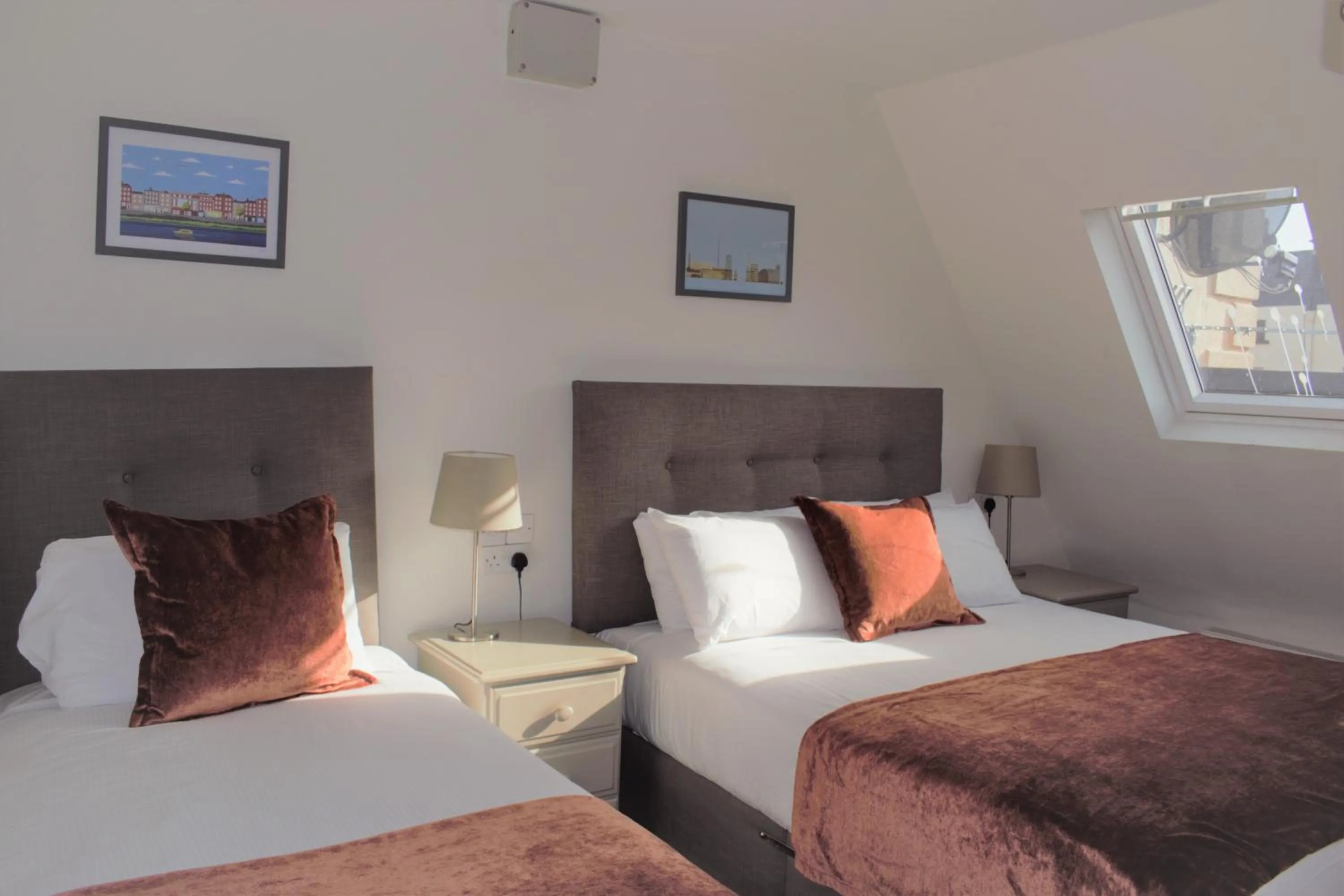 Bed in Tom Dick and Harriet's Accommodation