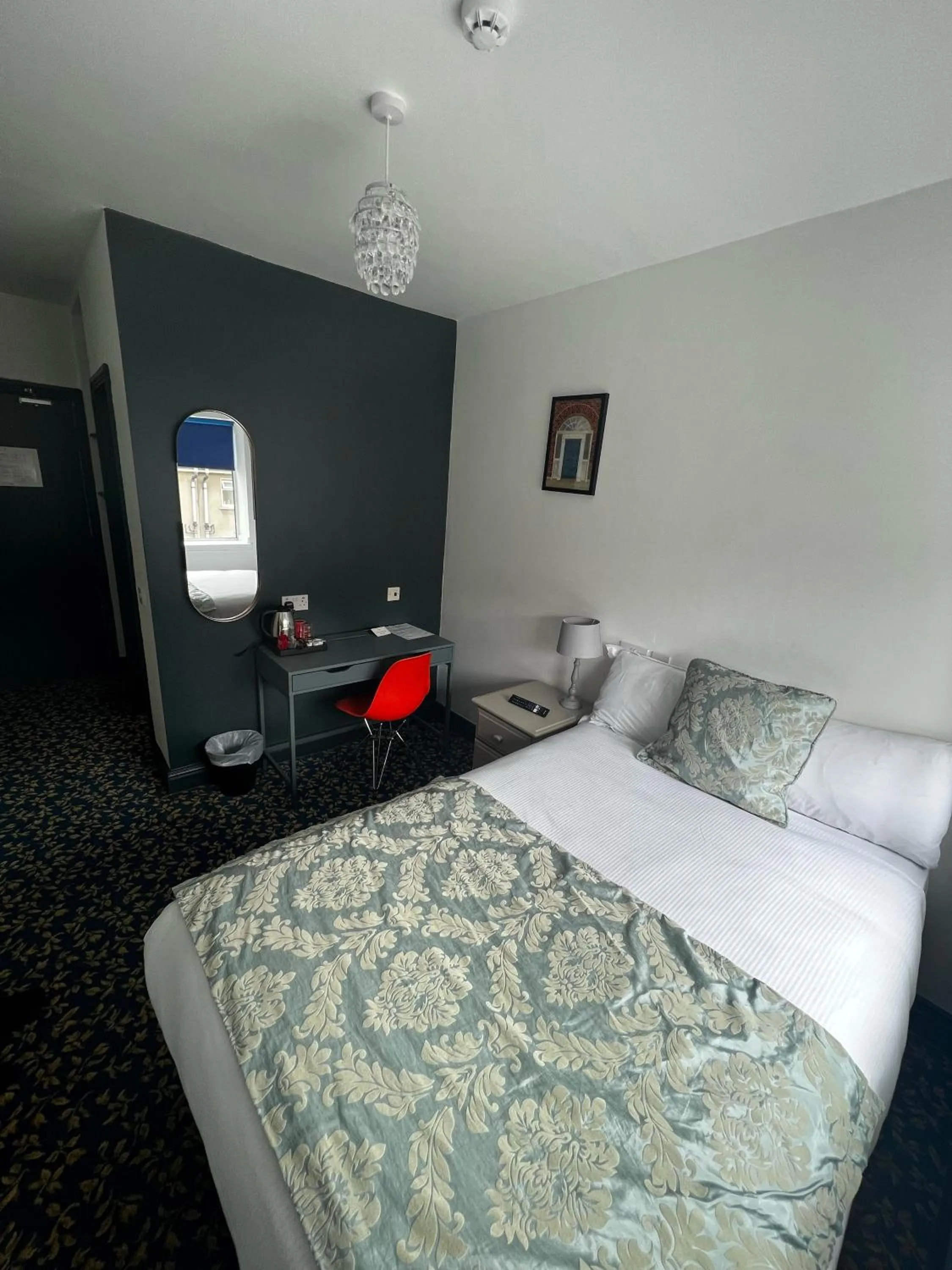 Bed in Tom Dick and Harriet's Accommodation