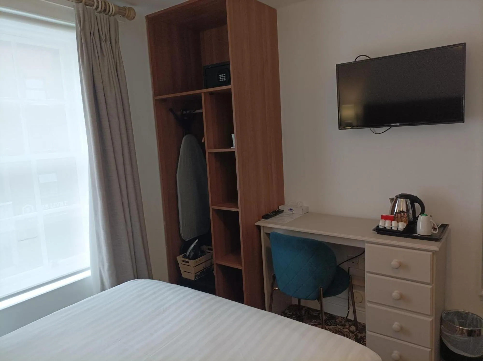 Bed in Tom Dick and Harriet's Accommodation