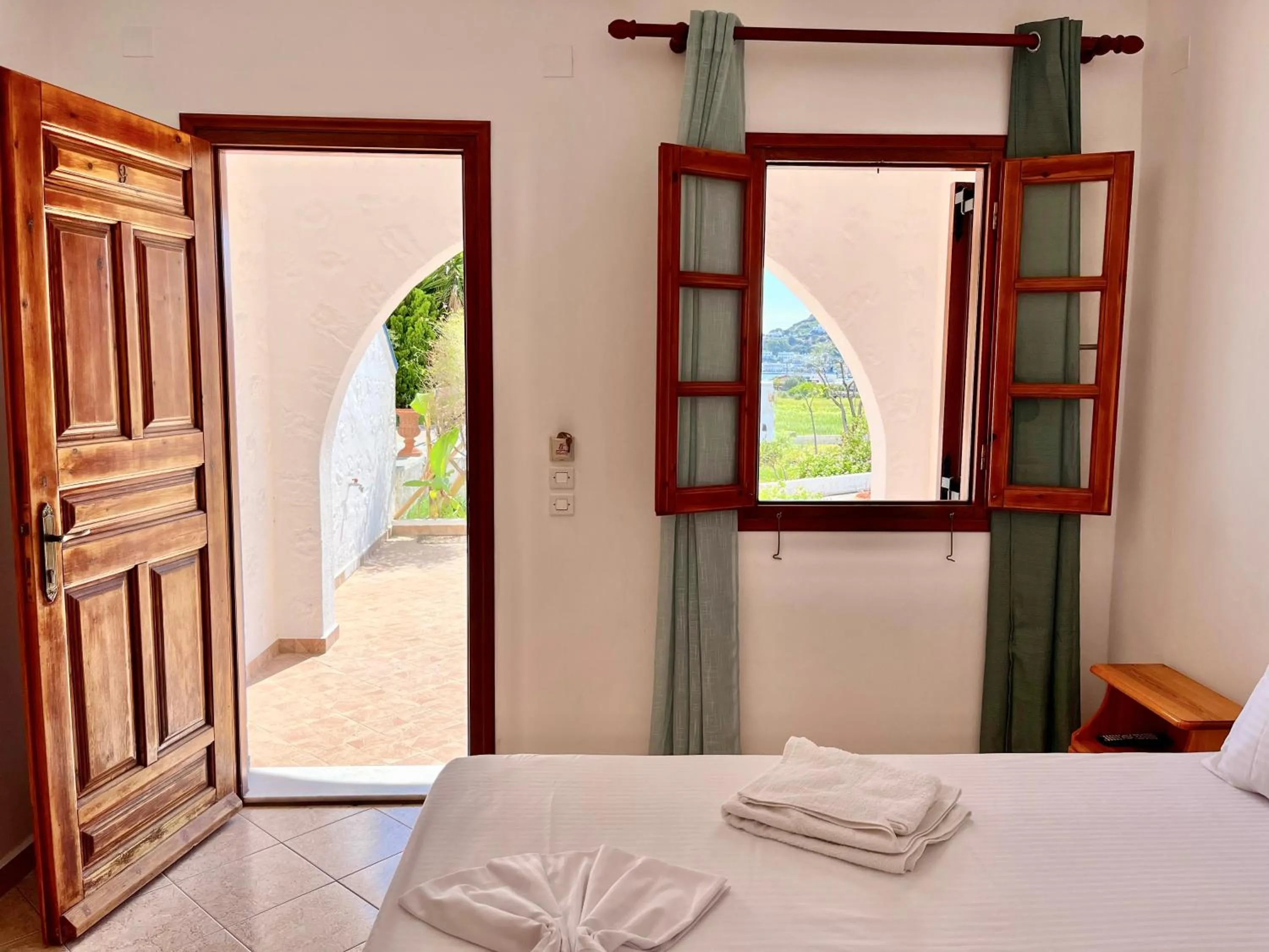 Photo of the whole room, Bed in Nicolas Studios