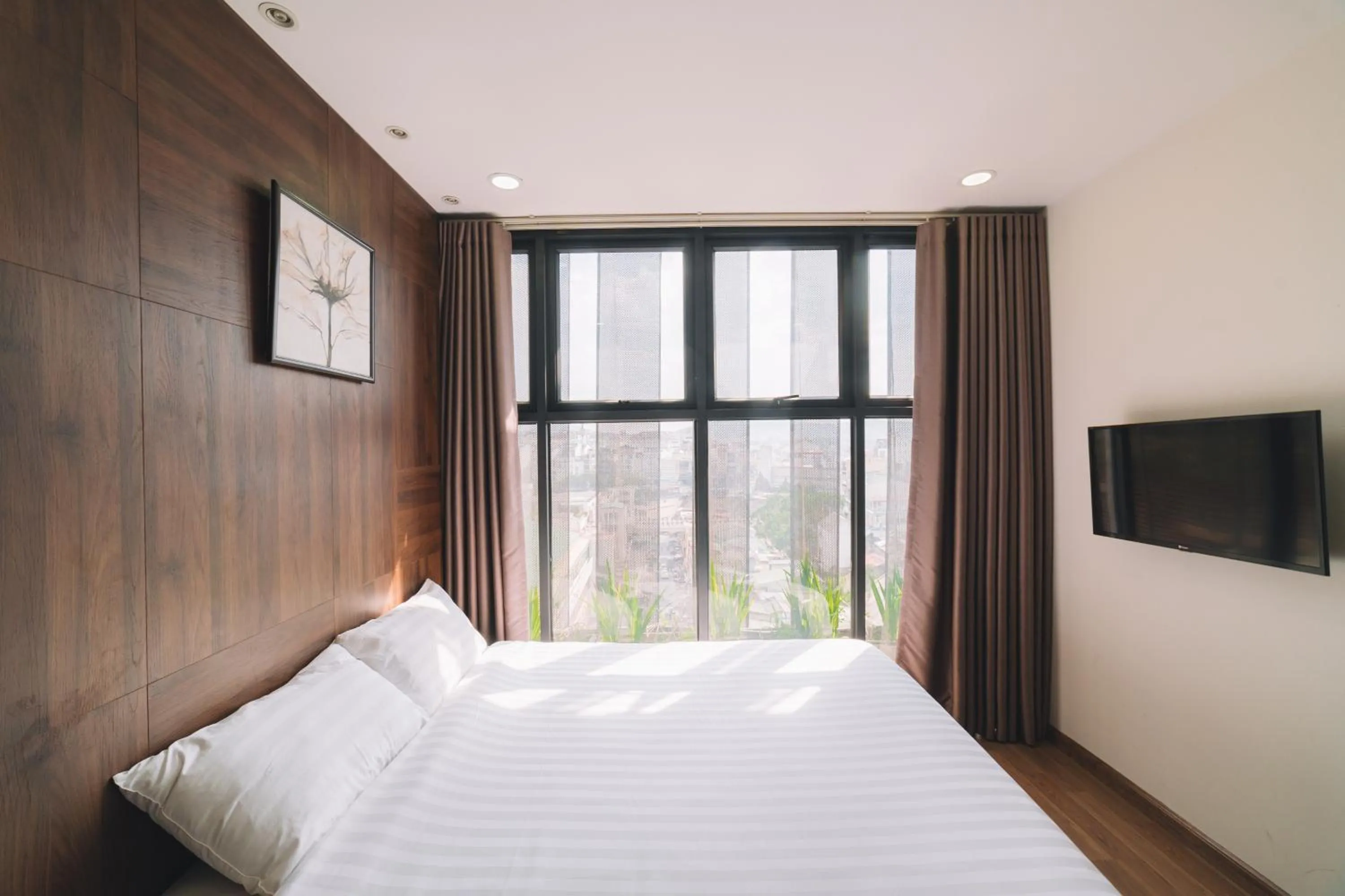 Communal lounge/ TV room, Bed in Dalat Center Residence