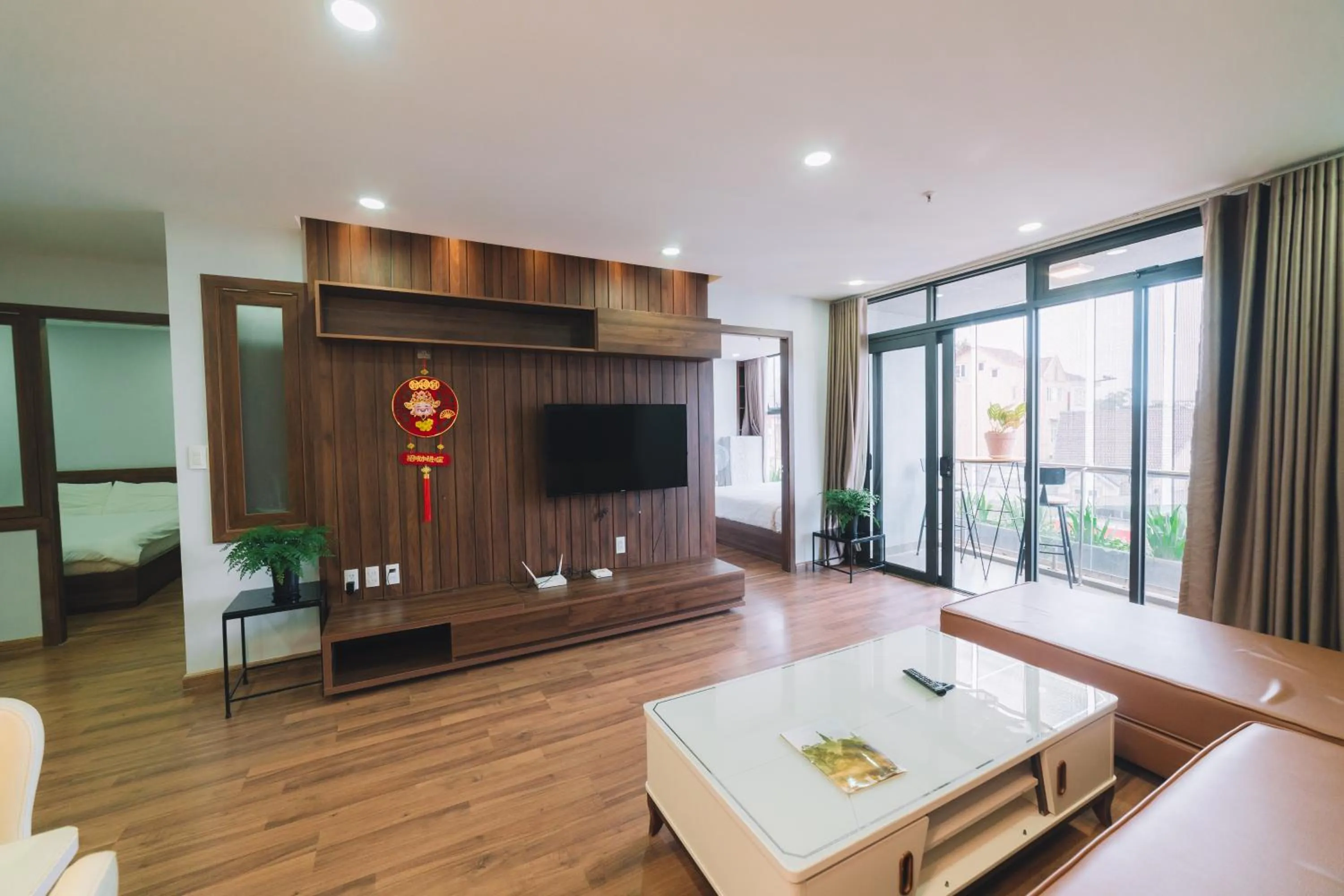 Communal lounge/ TV room, Bed in Dalat Center Residence