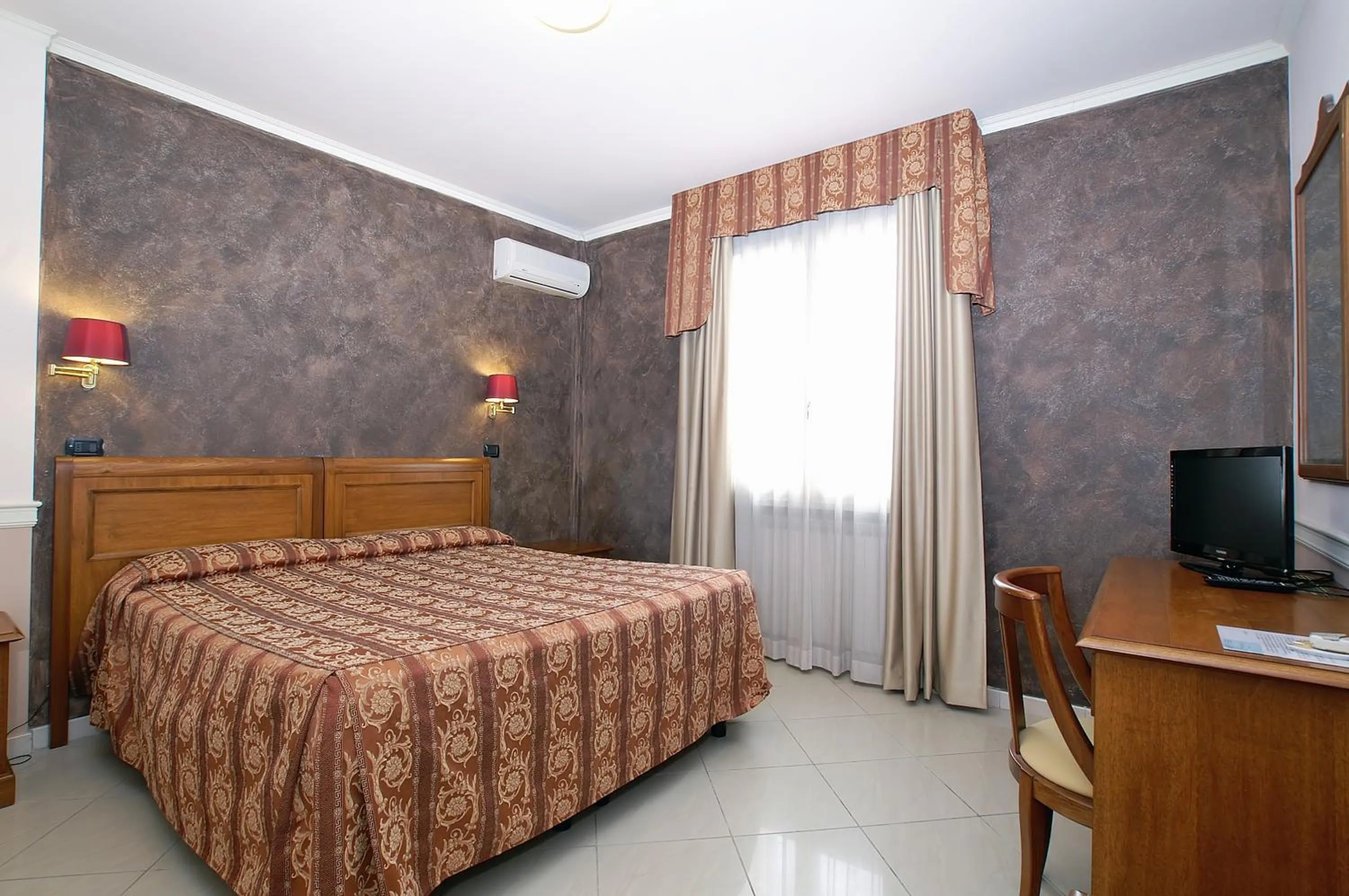 Bed in Hotel Coluccini