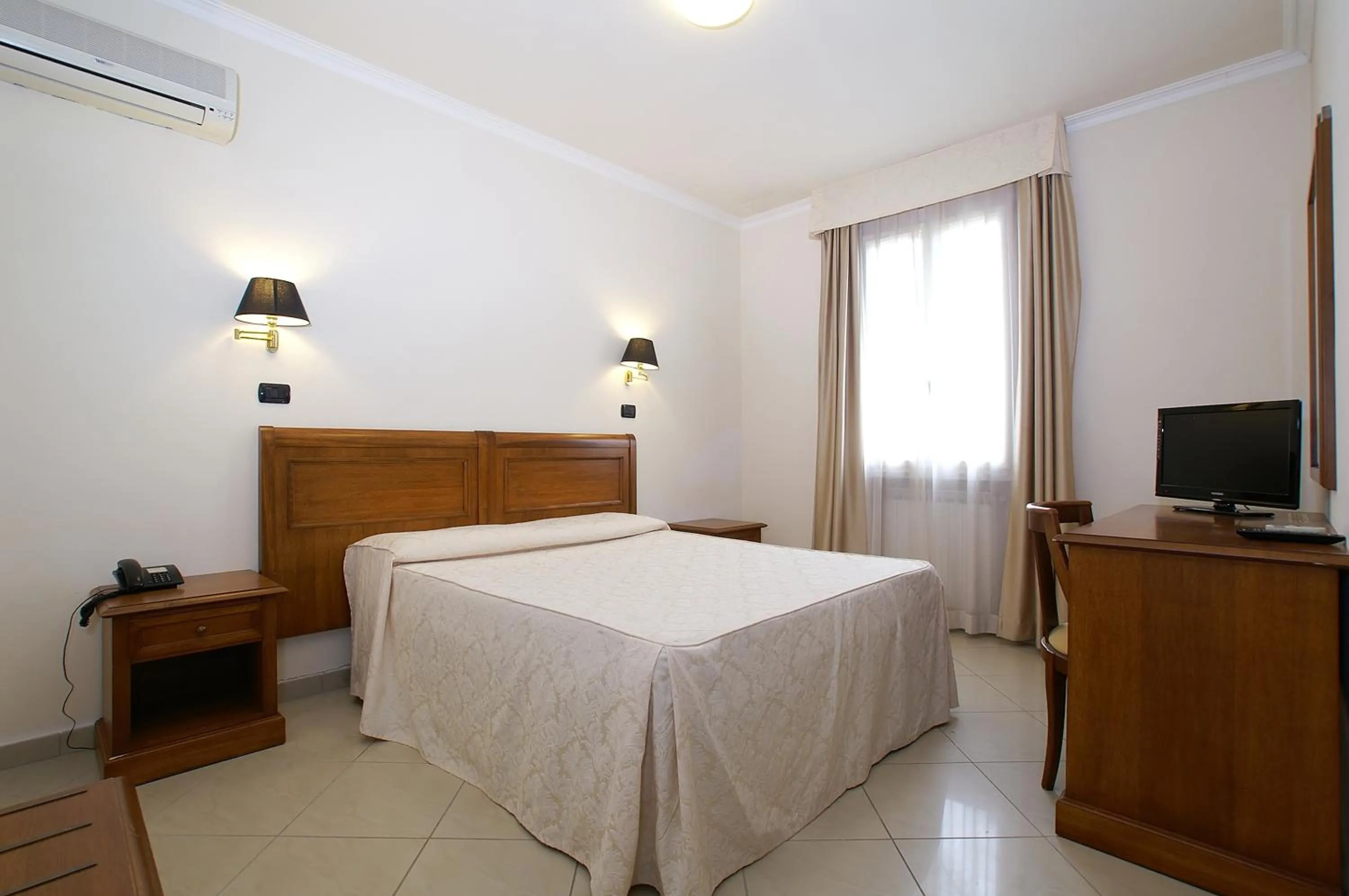 Bed in Hotel Coluccini