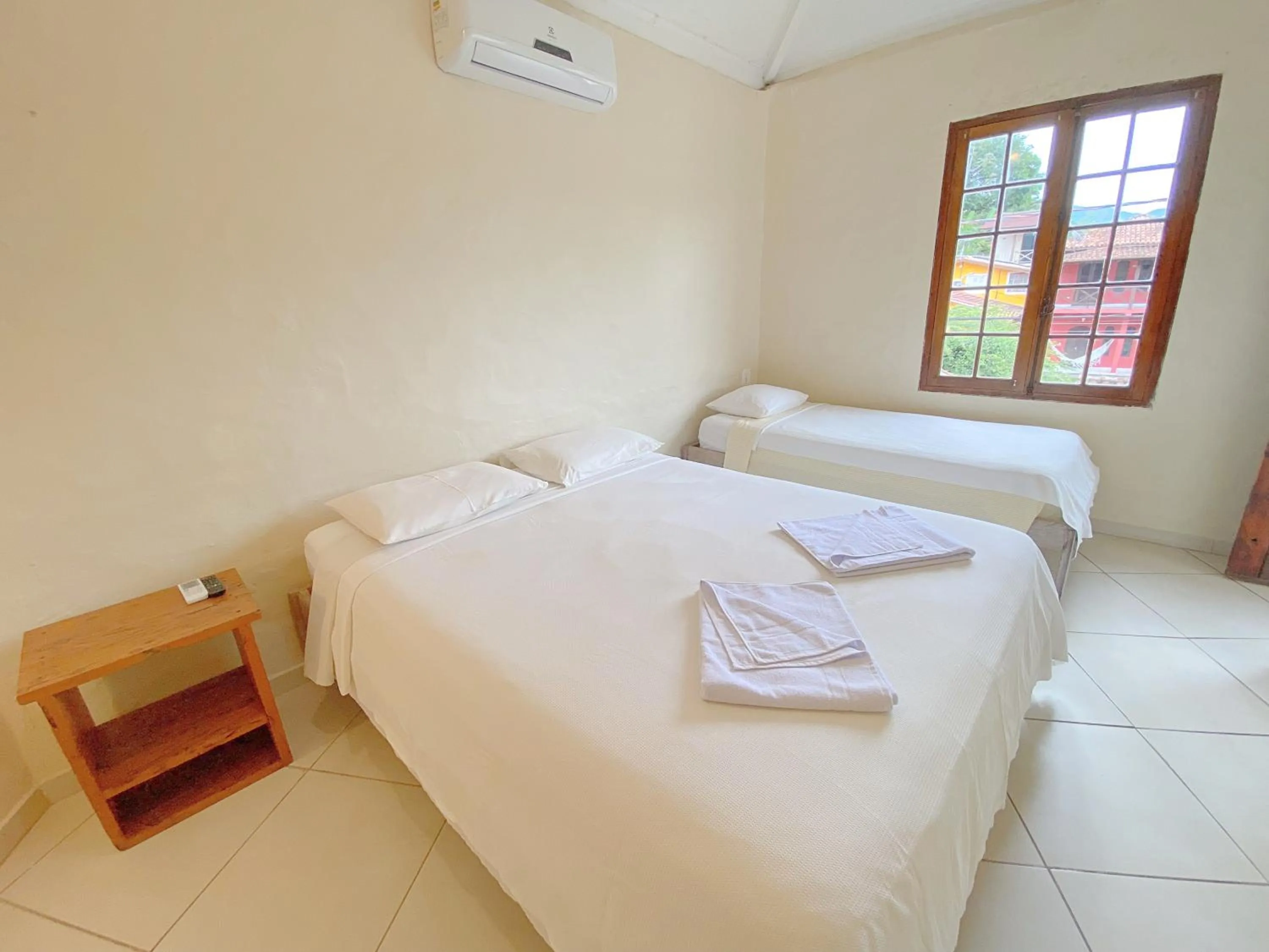 Property building, Bed in Pousada Montemar