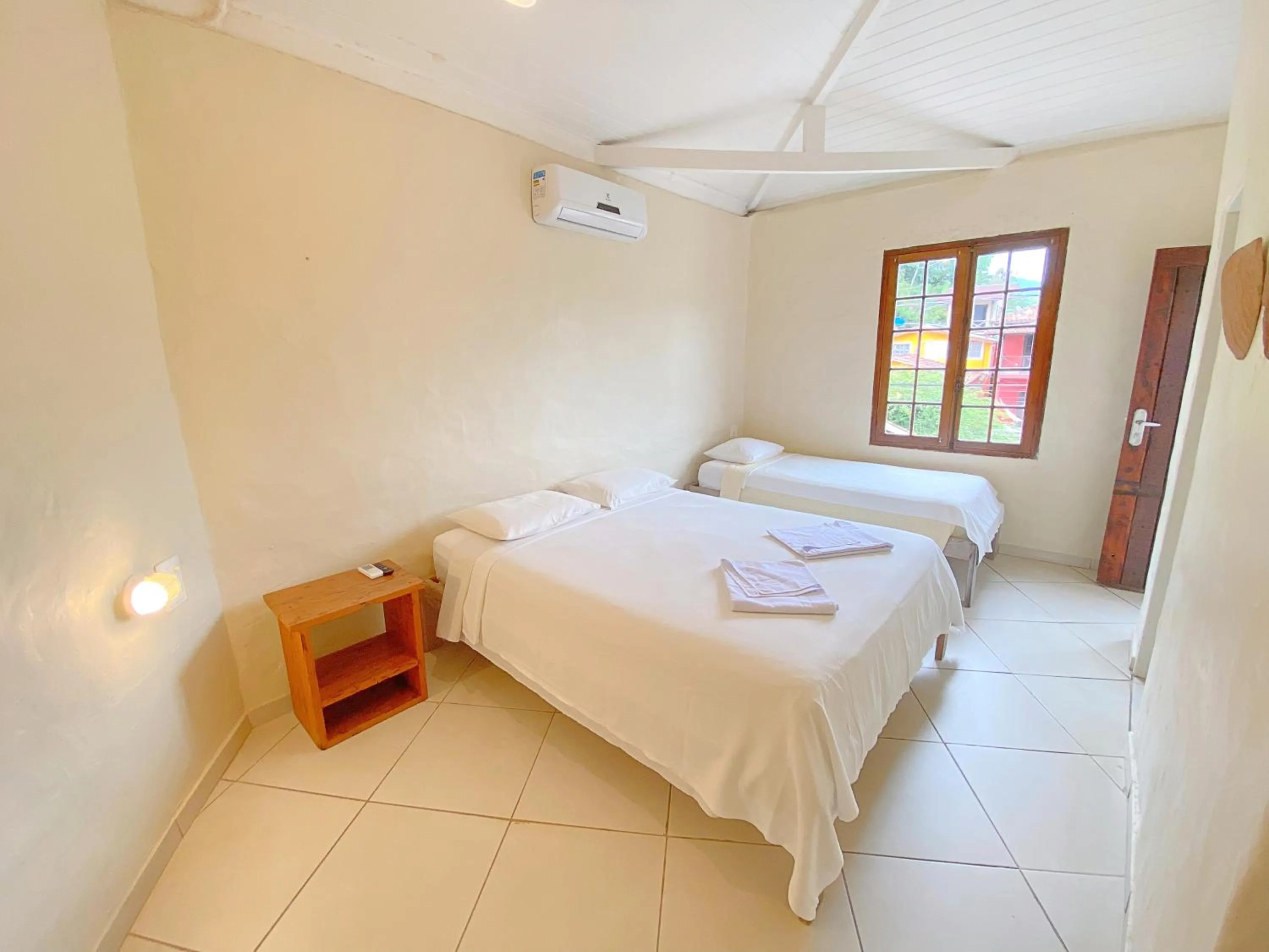 Property building, Bed in Pousada Montemar