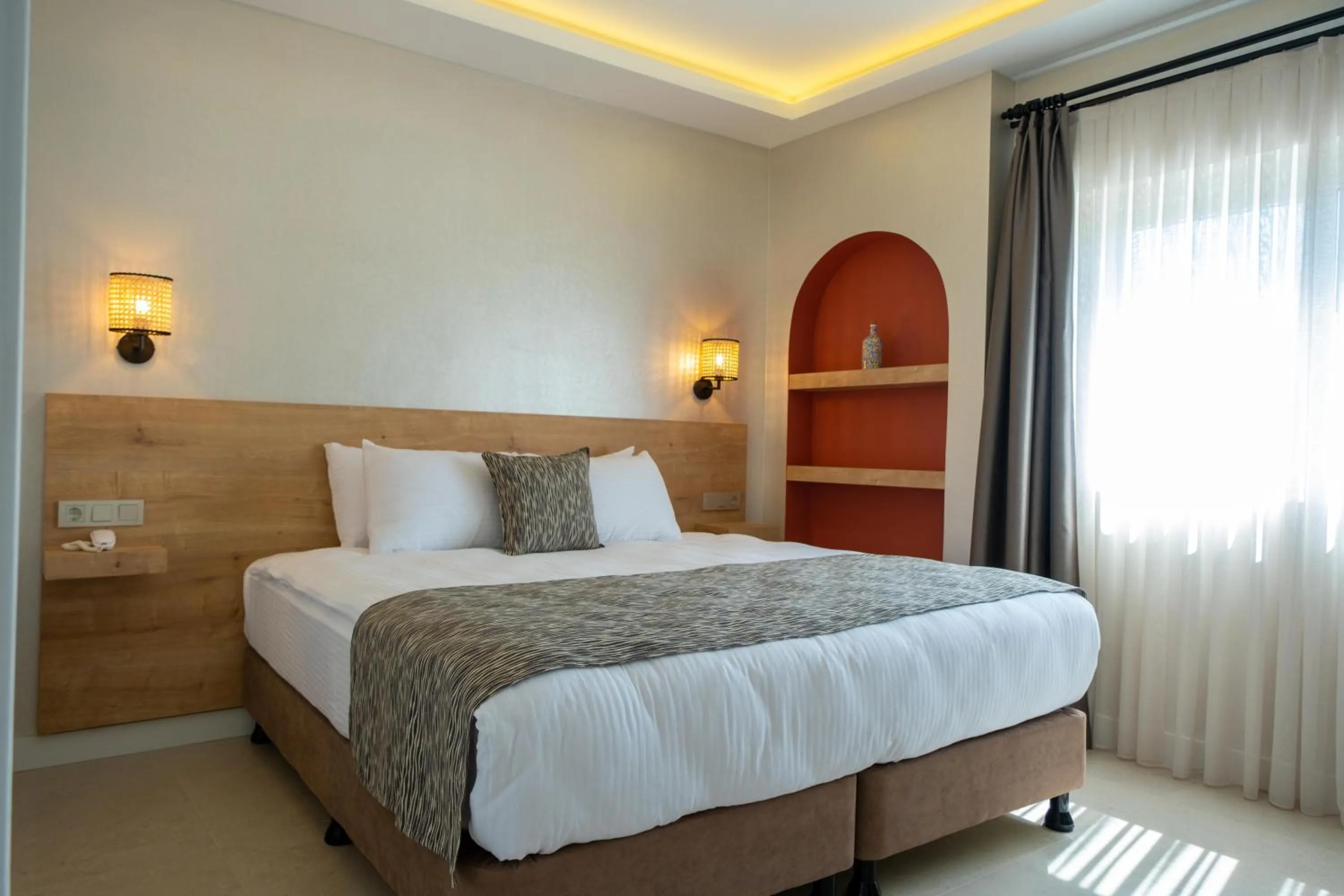 Bed in Sea Breeze Hotel and Apartments