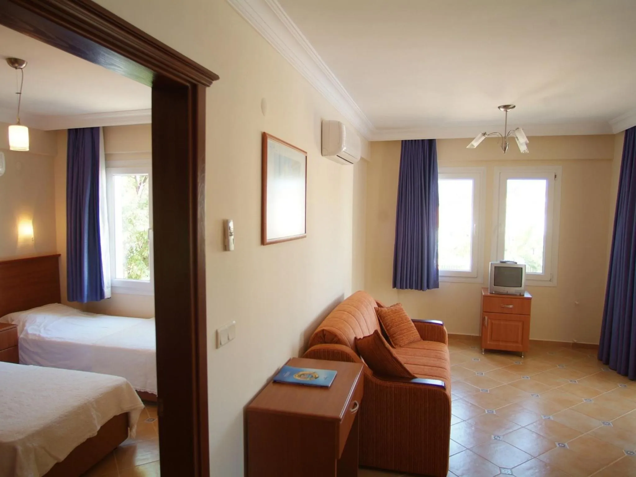 Bed in Sea Breeze Hotel and Apartments