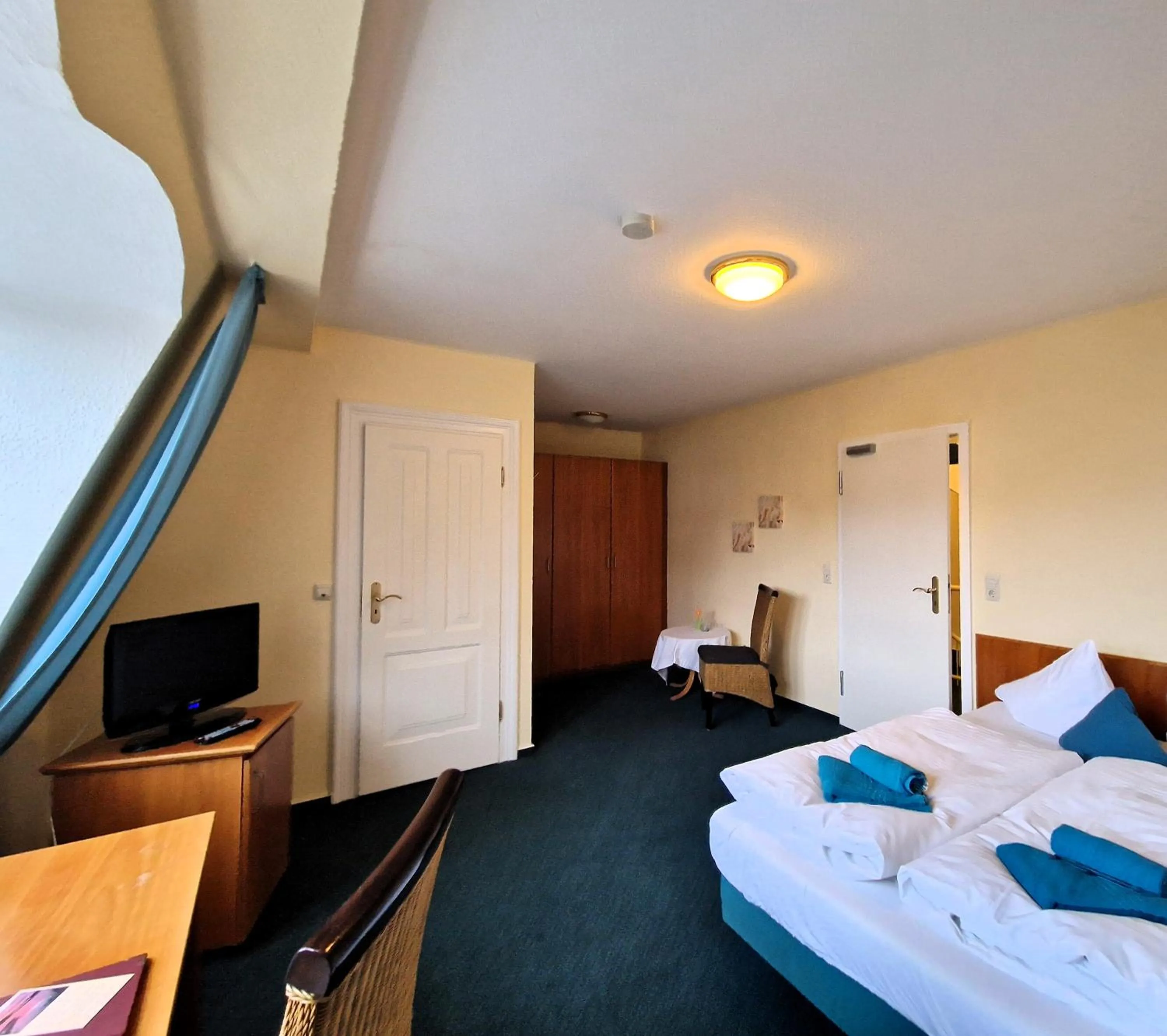 Photo of the whole room, Bed in Hotel Fährhaus Niederkleveez