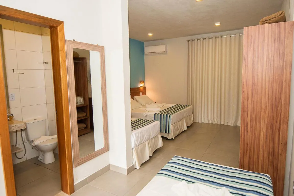 Bed in Pousada Tropicarim