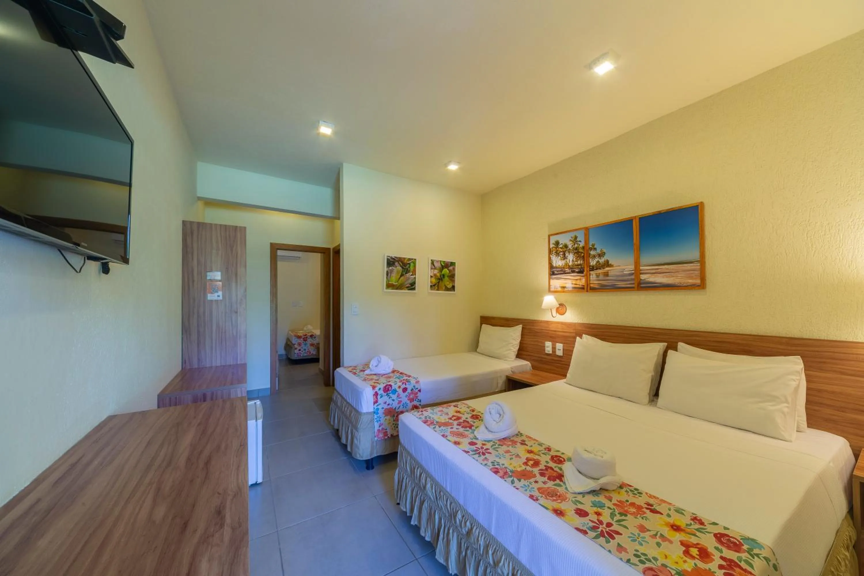 Bed in Pousada Tropicarim