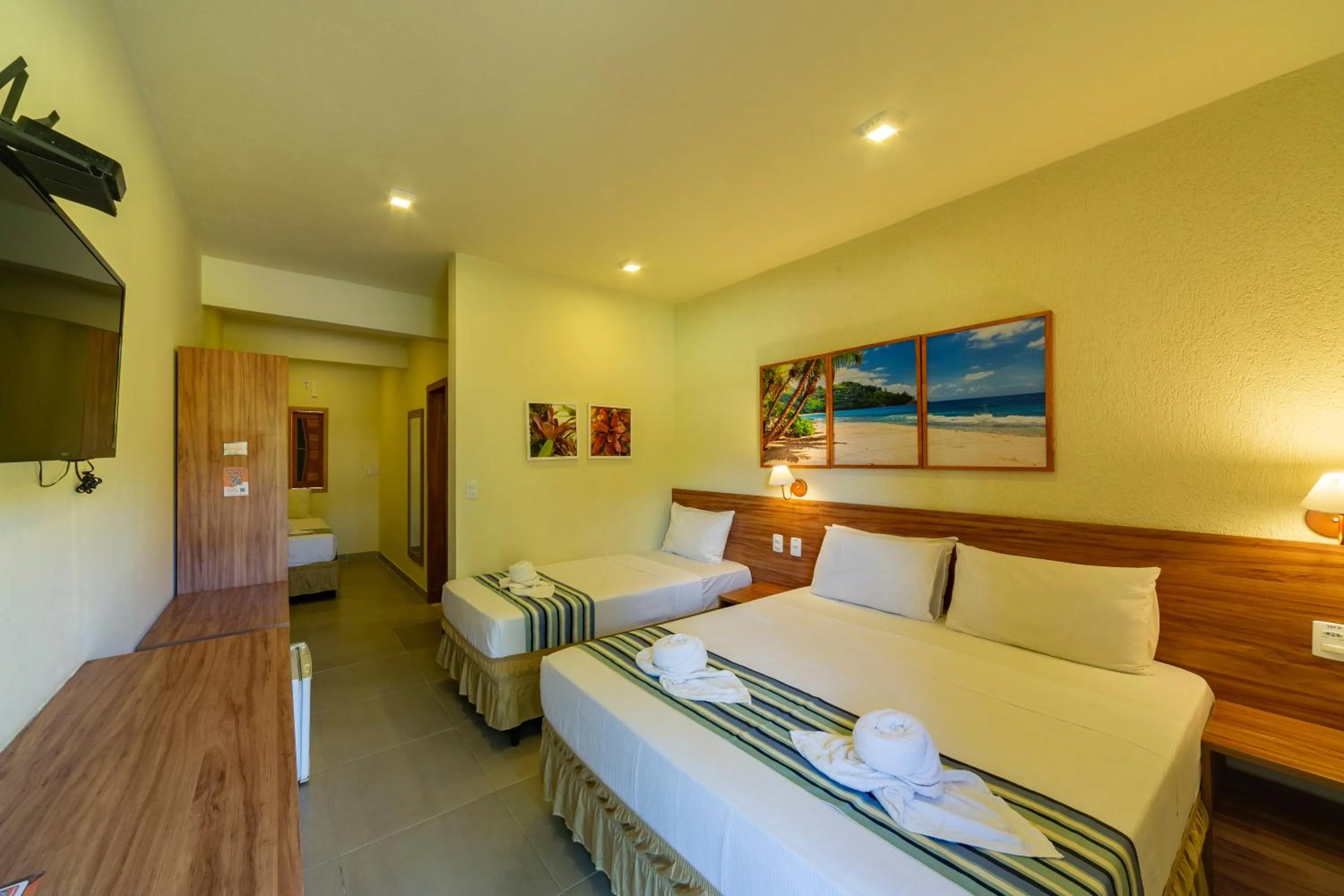 Bed in Pousada Tropicarim