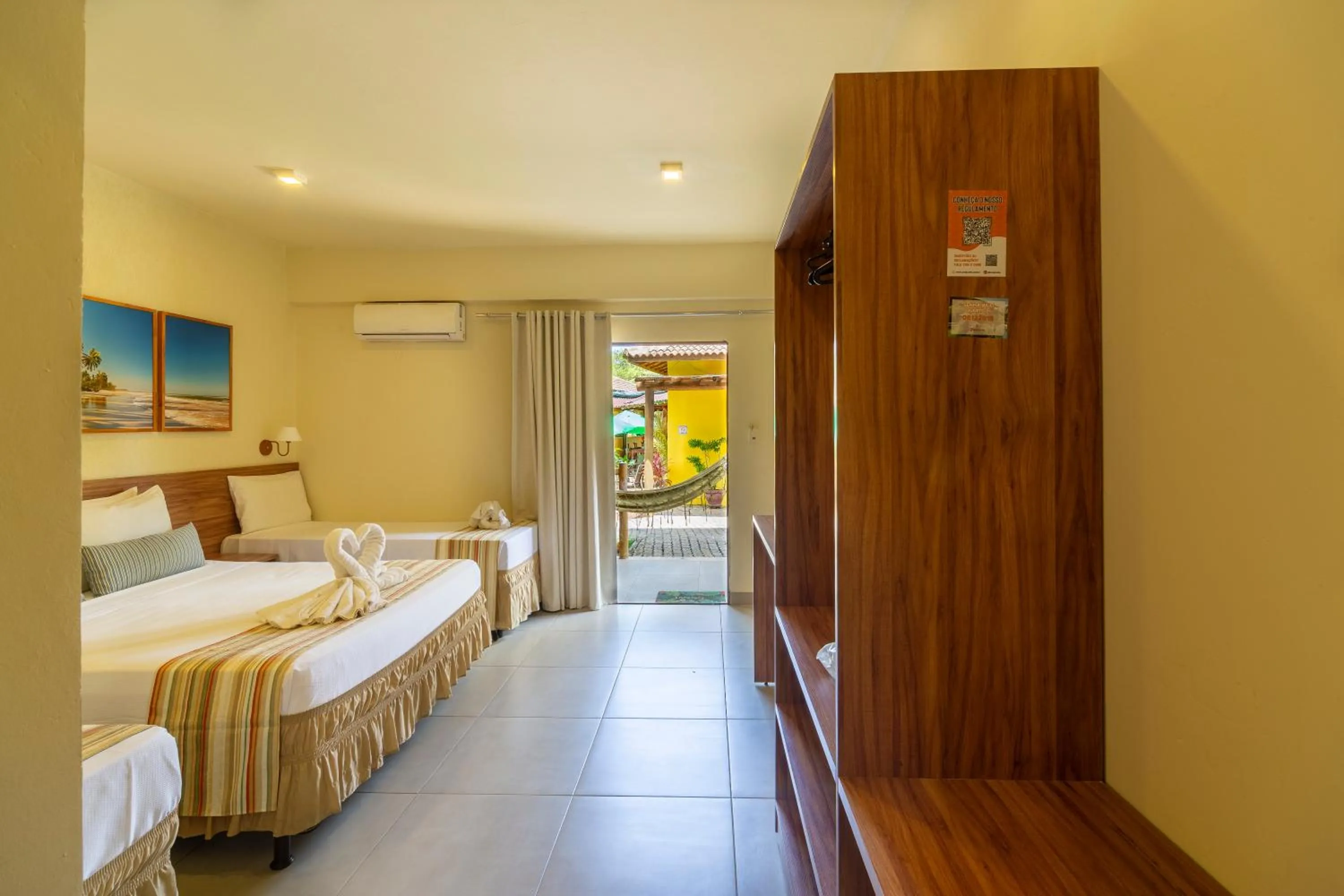 Bed in Pousada Tropicarim