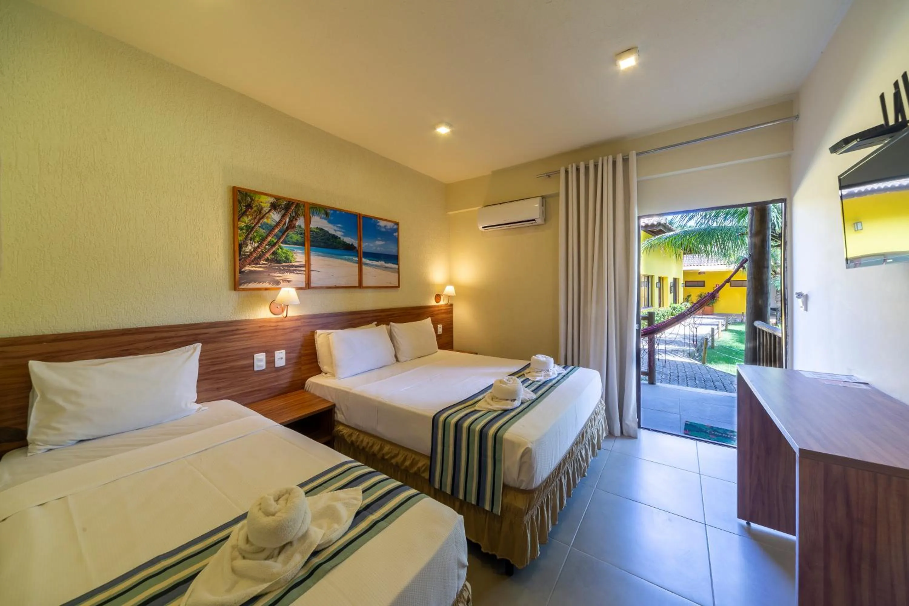 Bed in Pousada Tropicarim