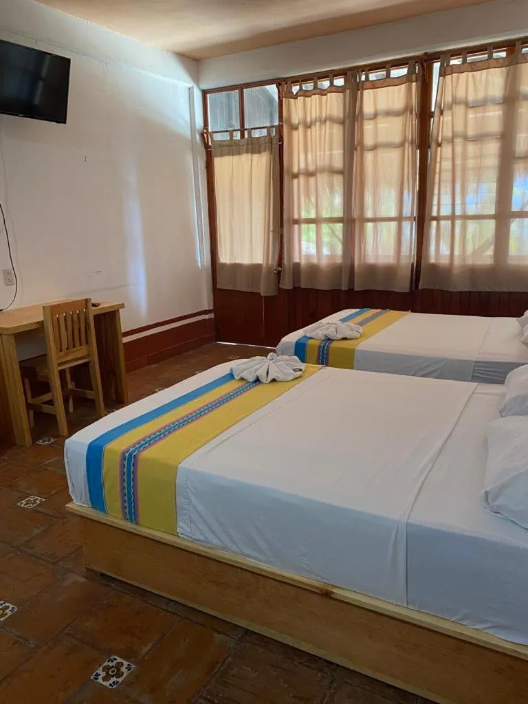 Bed in Hotel Bungalows Acuario
