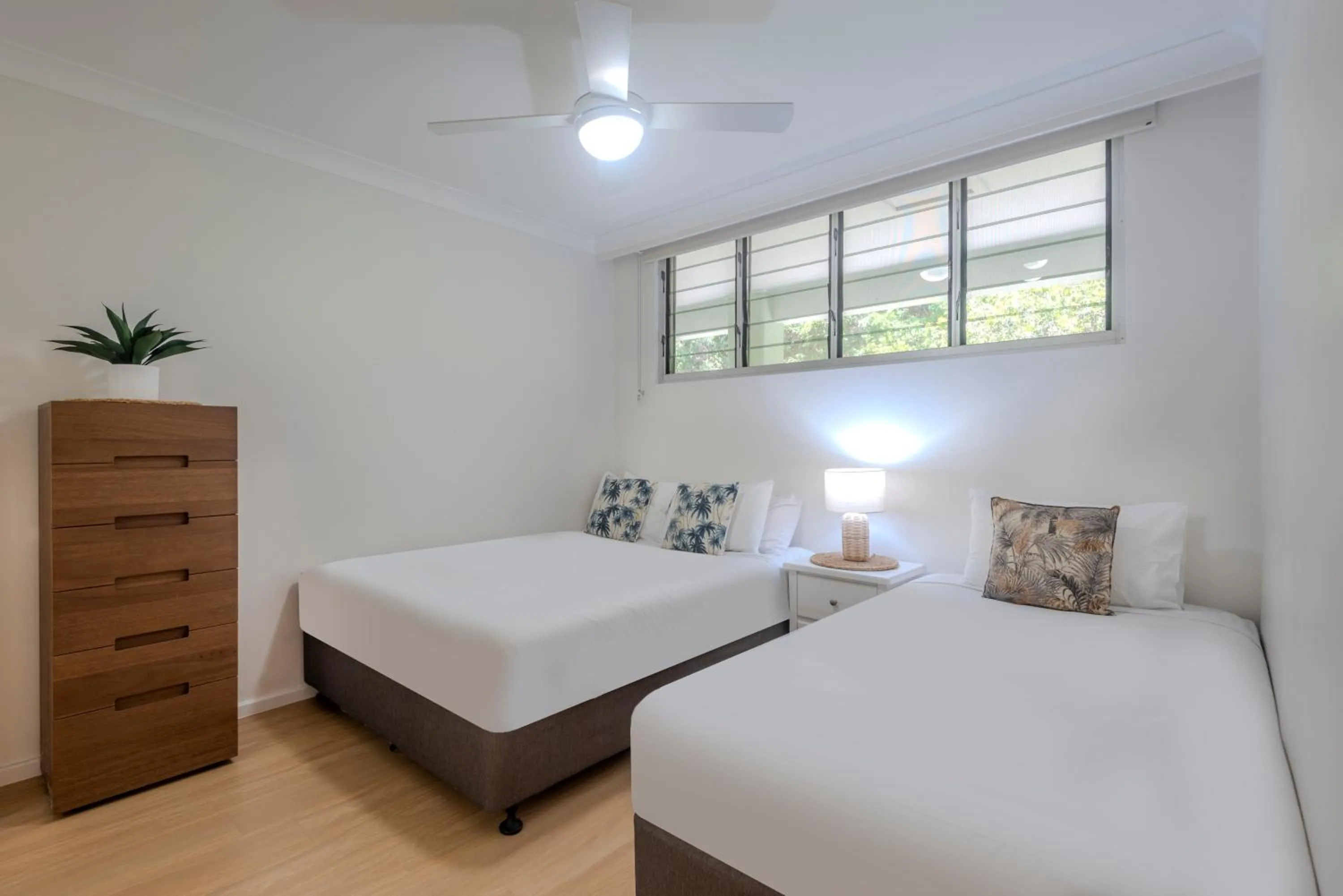 Bed in Lagoon Beachfront Lodge 202 on Hamilton Island by HamoRent