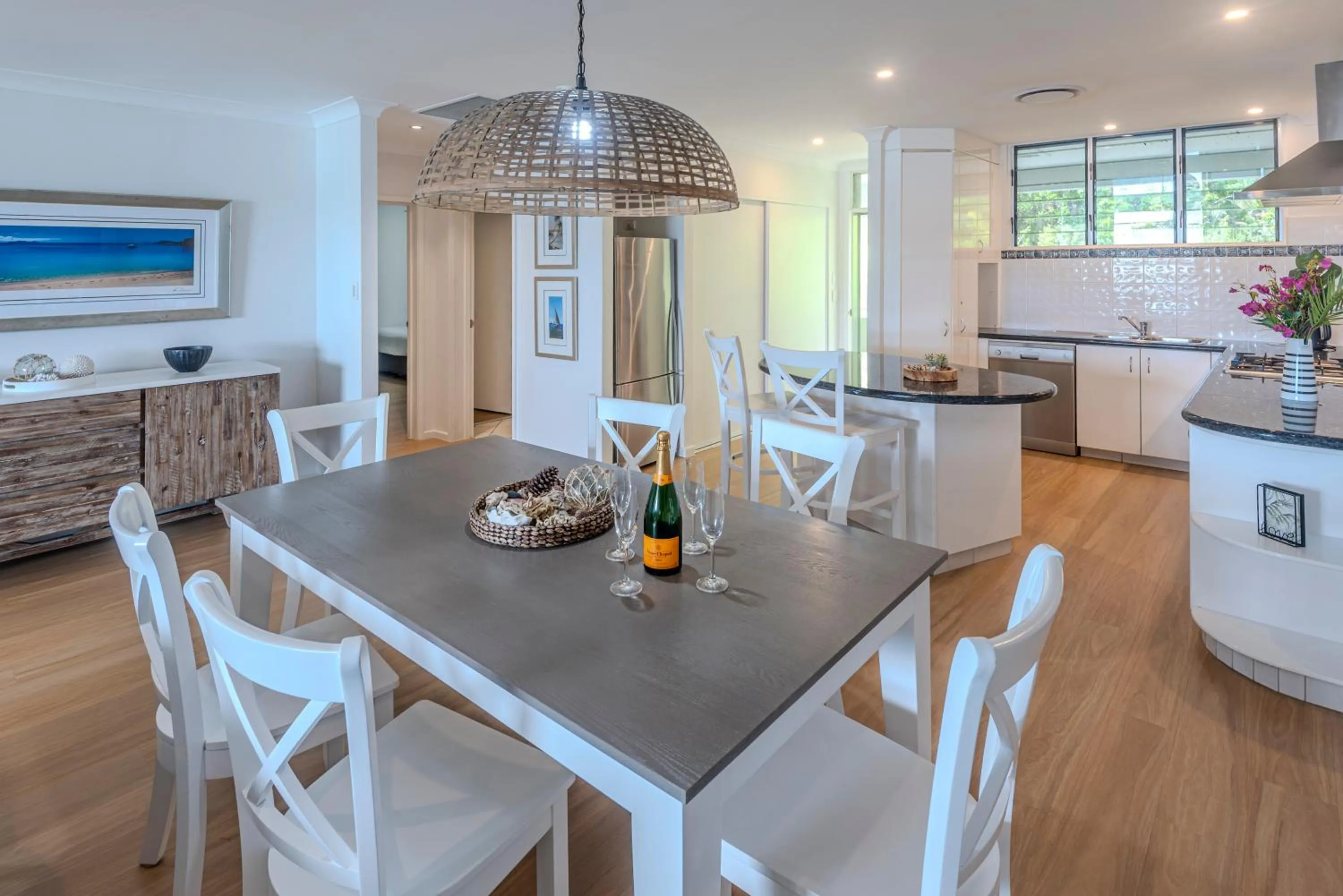 Dining area in Lagoon Beachfront Lodge 202 on Hamilton Island by HamoRent