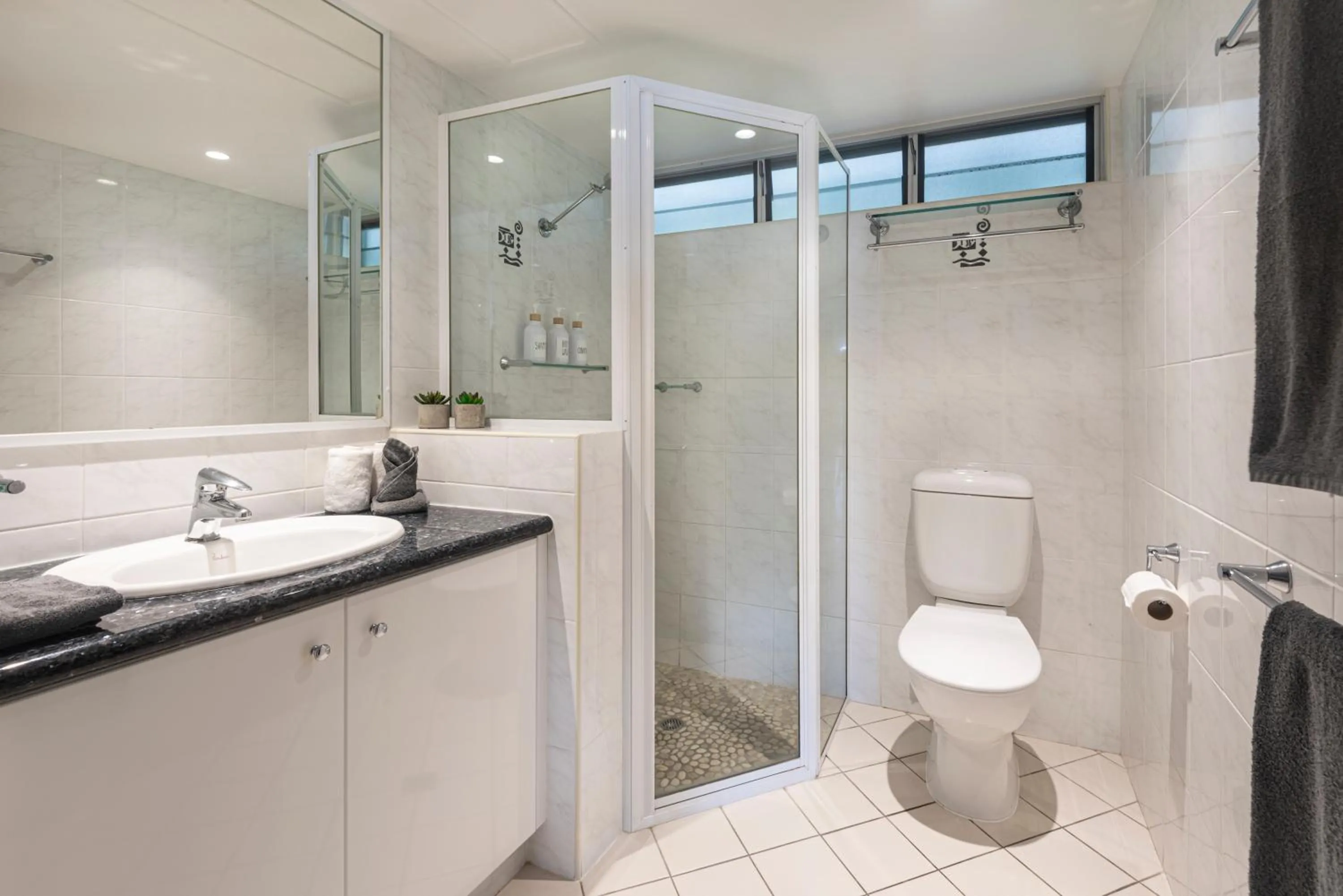 Shower in Lagoon Beachfront Lodge 202 on Hamilton Island by HamoRent