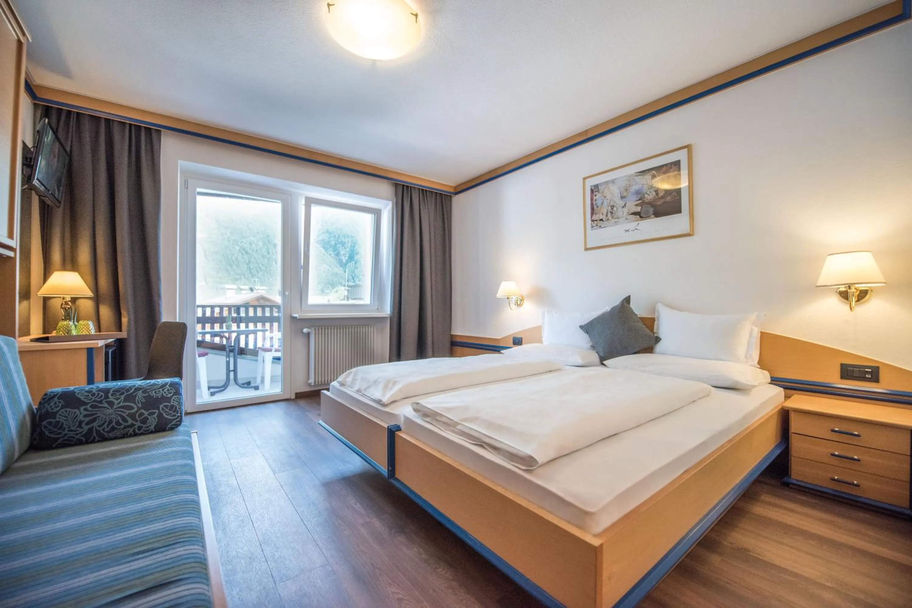 Bed in Vitaurina Royal Hotel