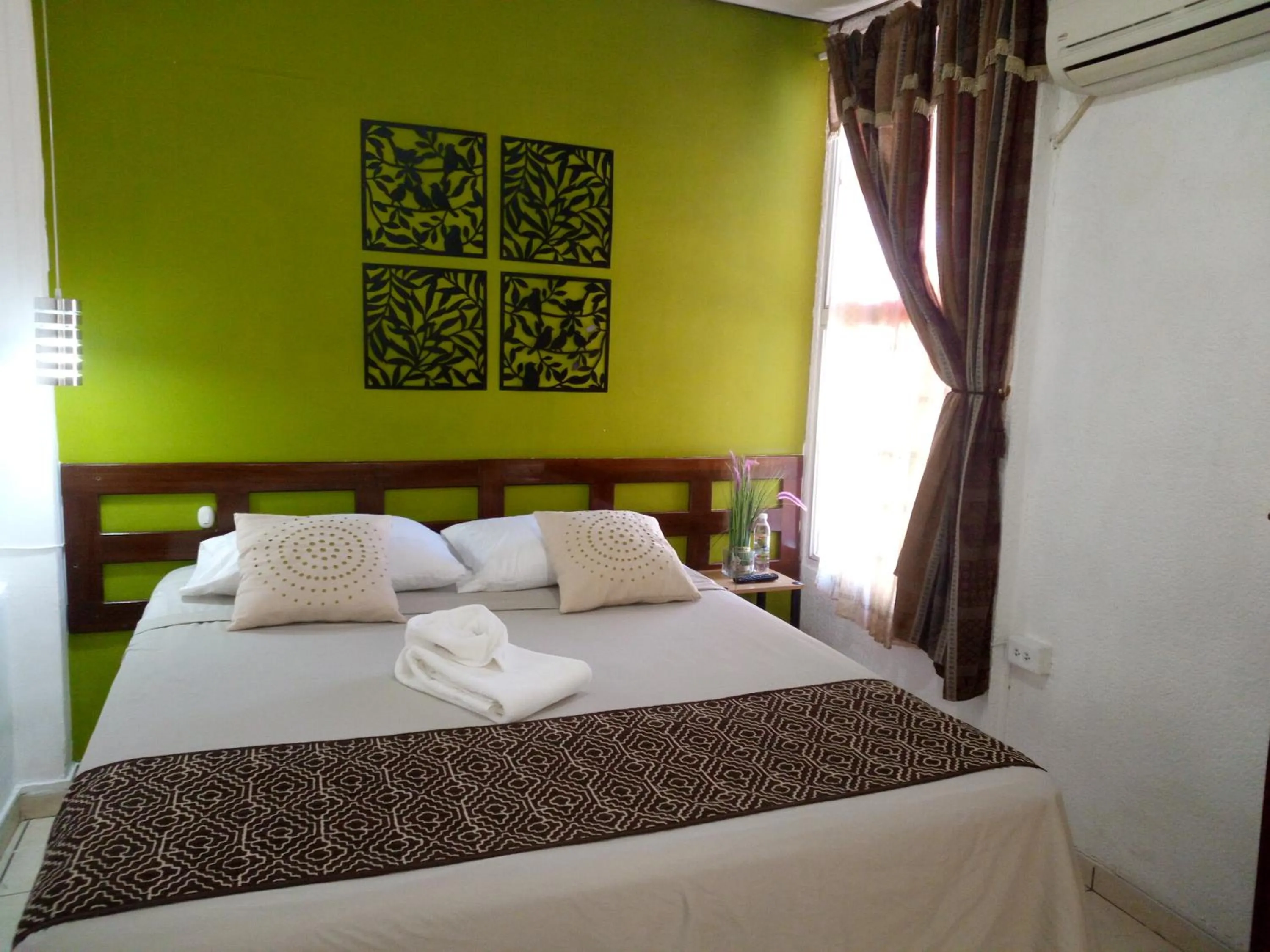 Bed in Hotel Tazumal House