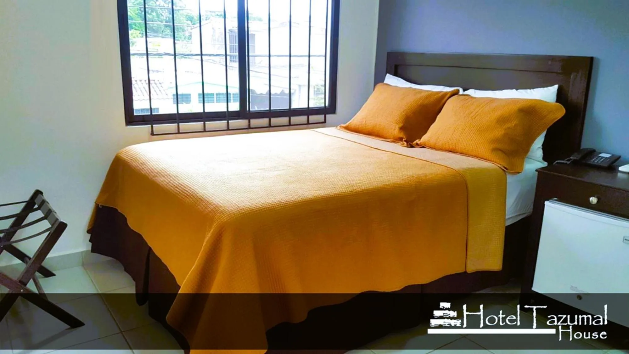 Bed in Hotel Tazumal House