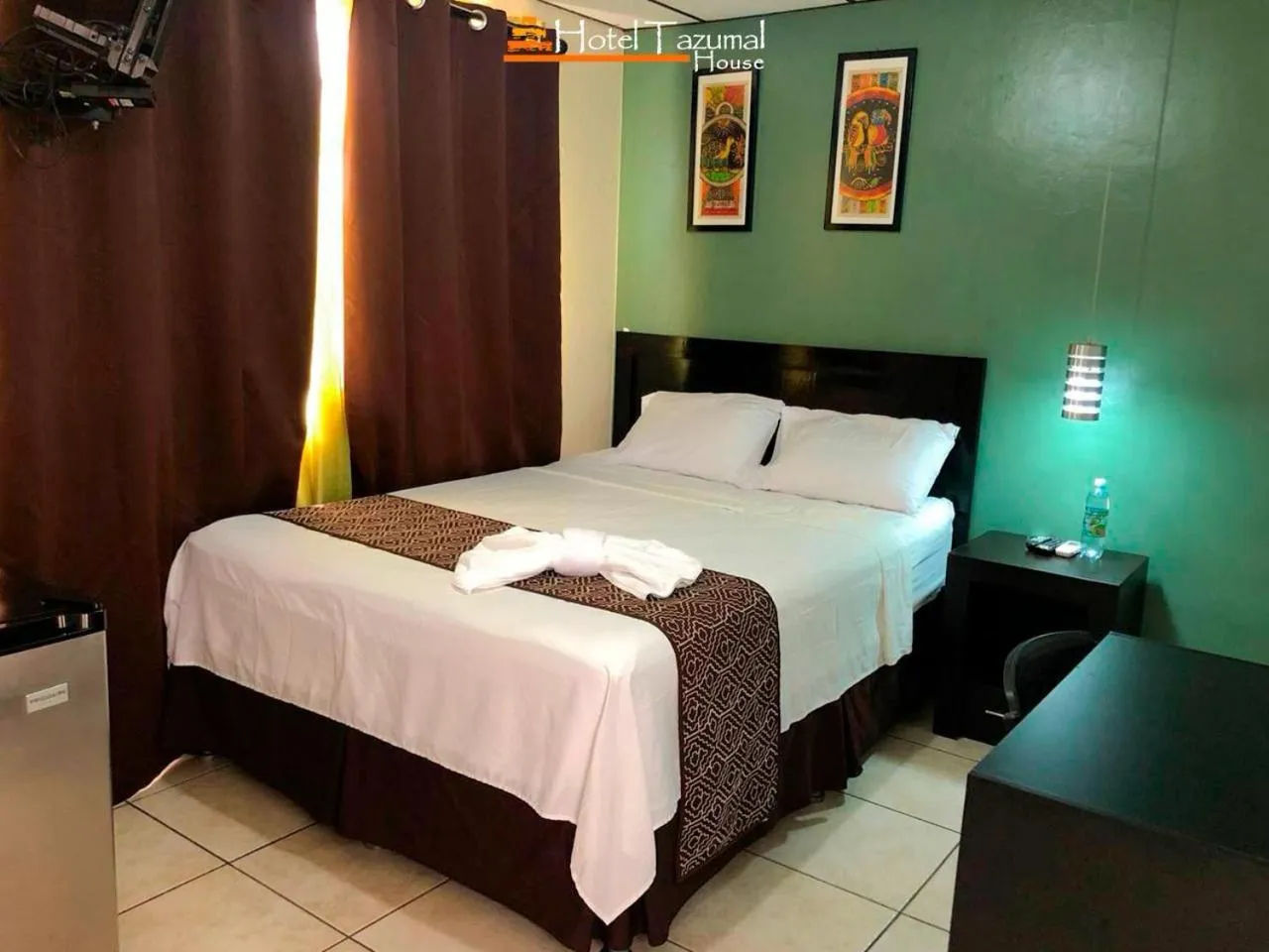 Bed in Hotel Tazumal House