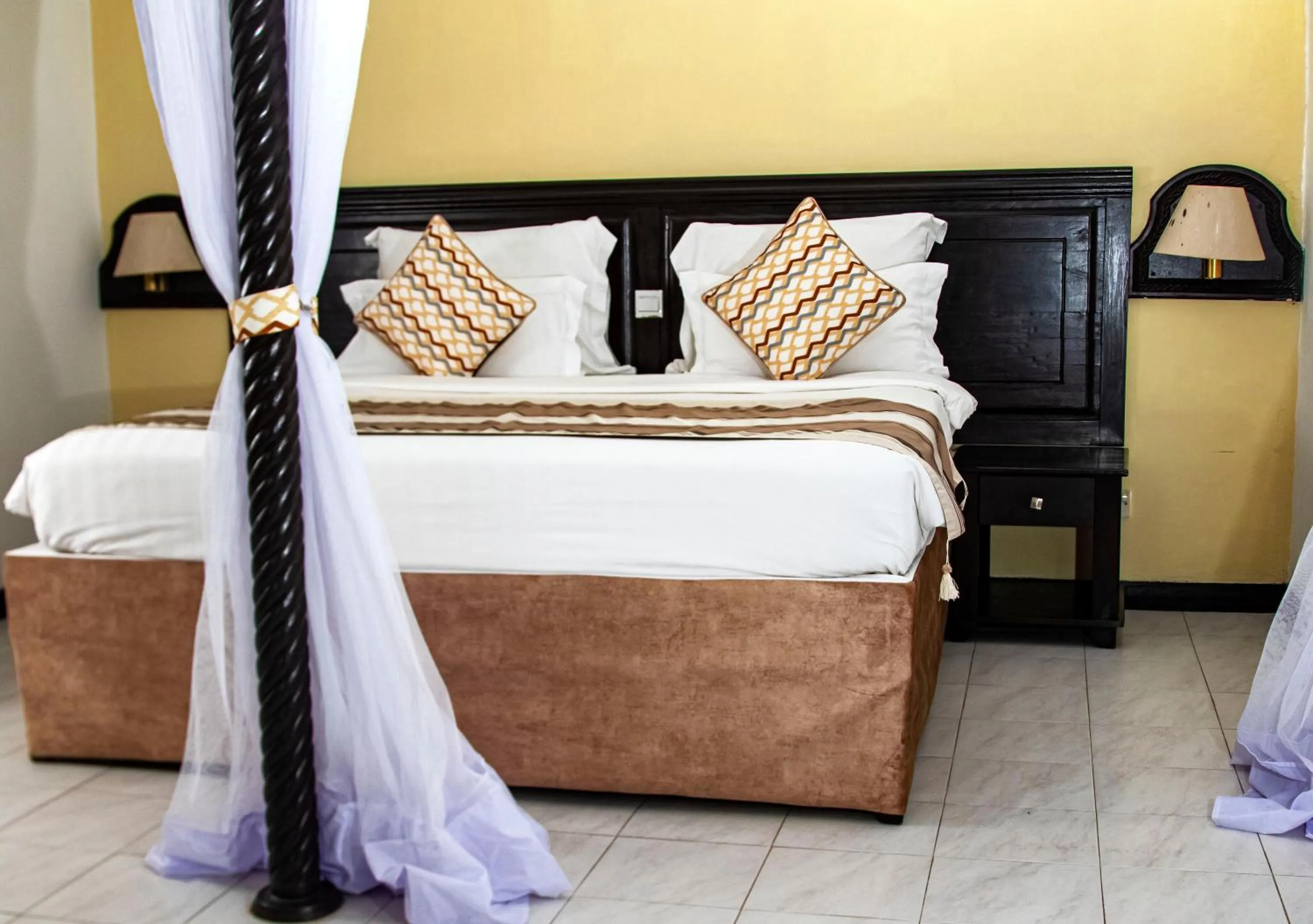 Bed in PrideInn Flamingo Beach Resort & Spa Mombasa