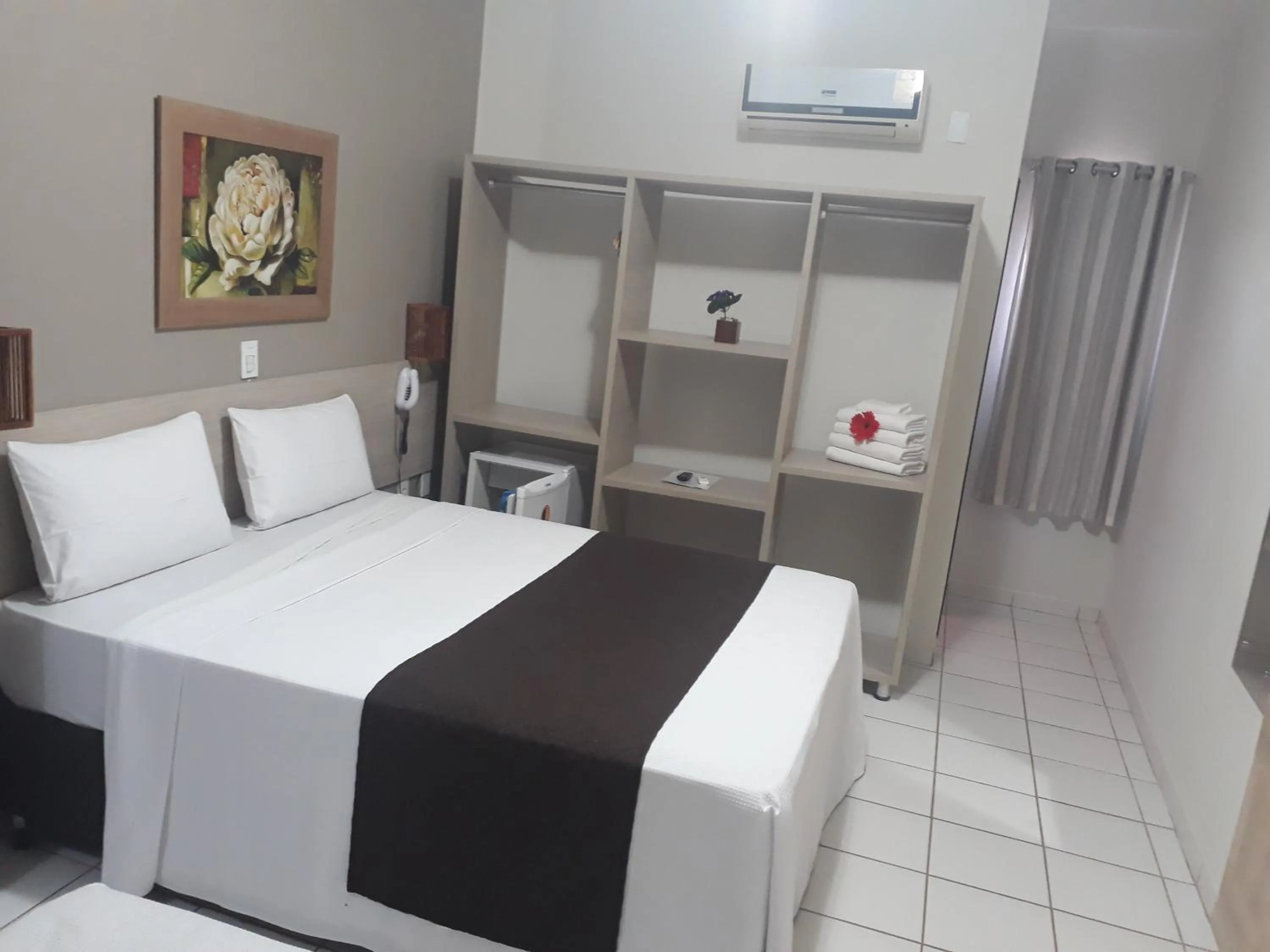 Bed in Pousada Maragolfinho