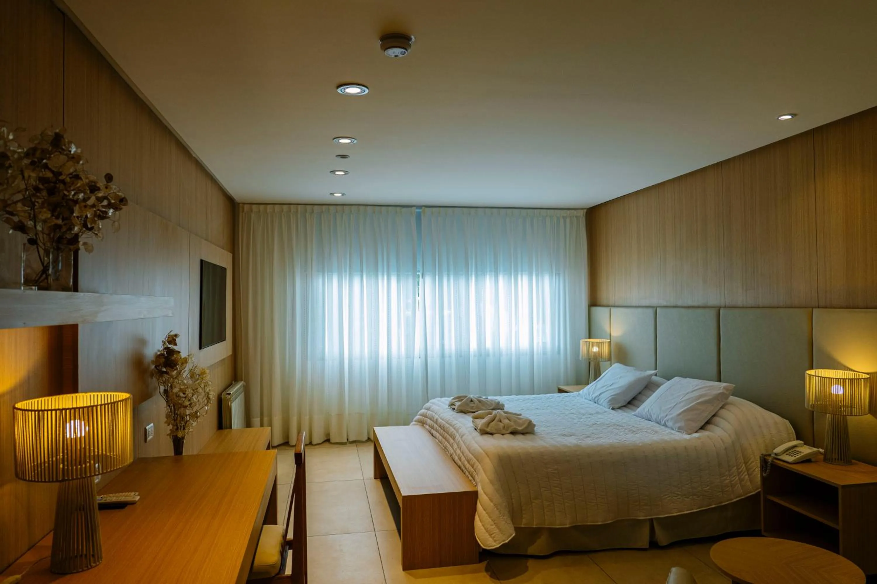 Bed in Plaza Paradiso Petit Hotel