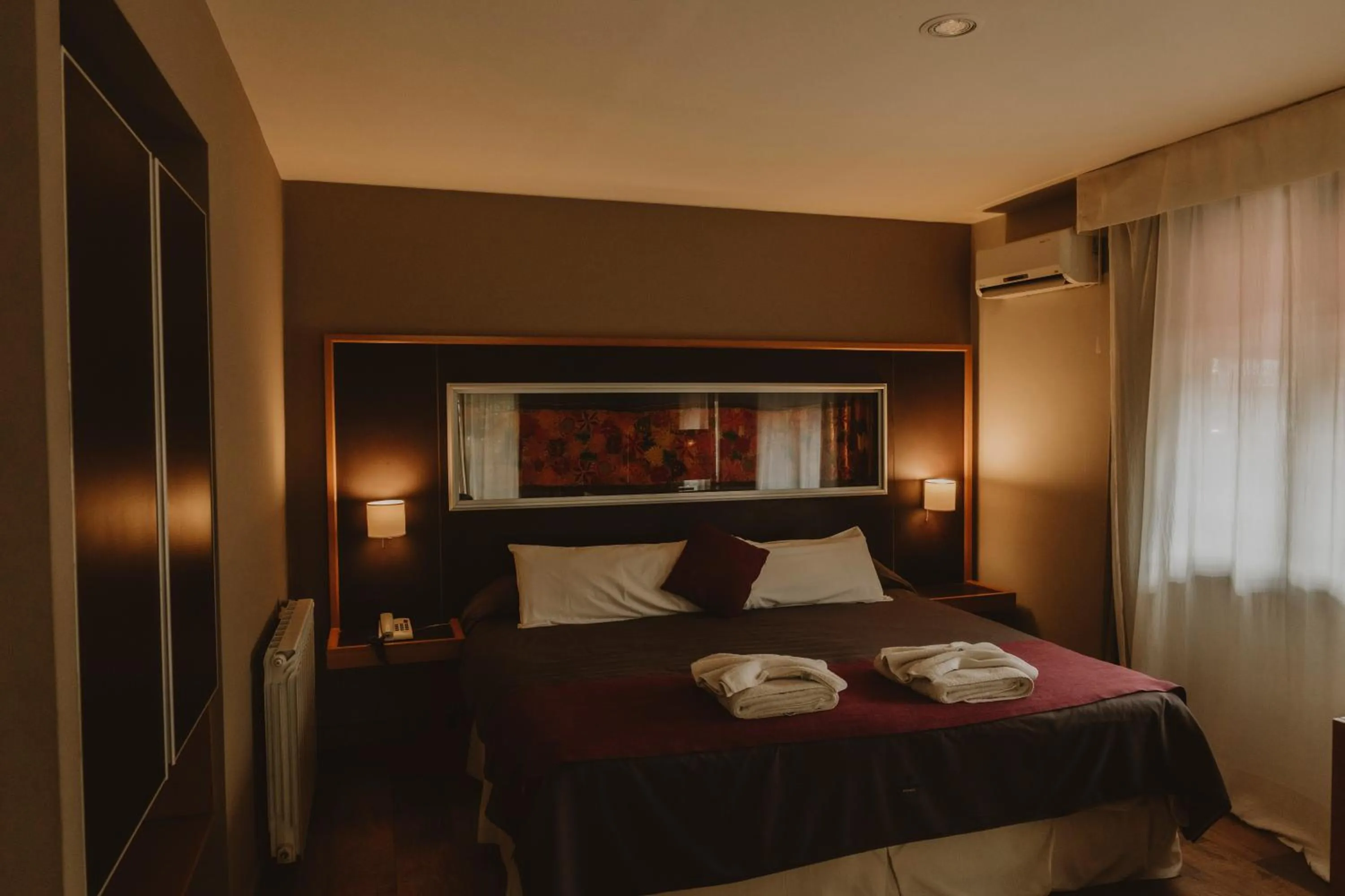 Bed in Plaza Paradiso Petit Hotel