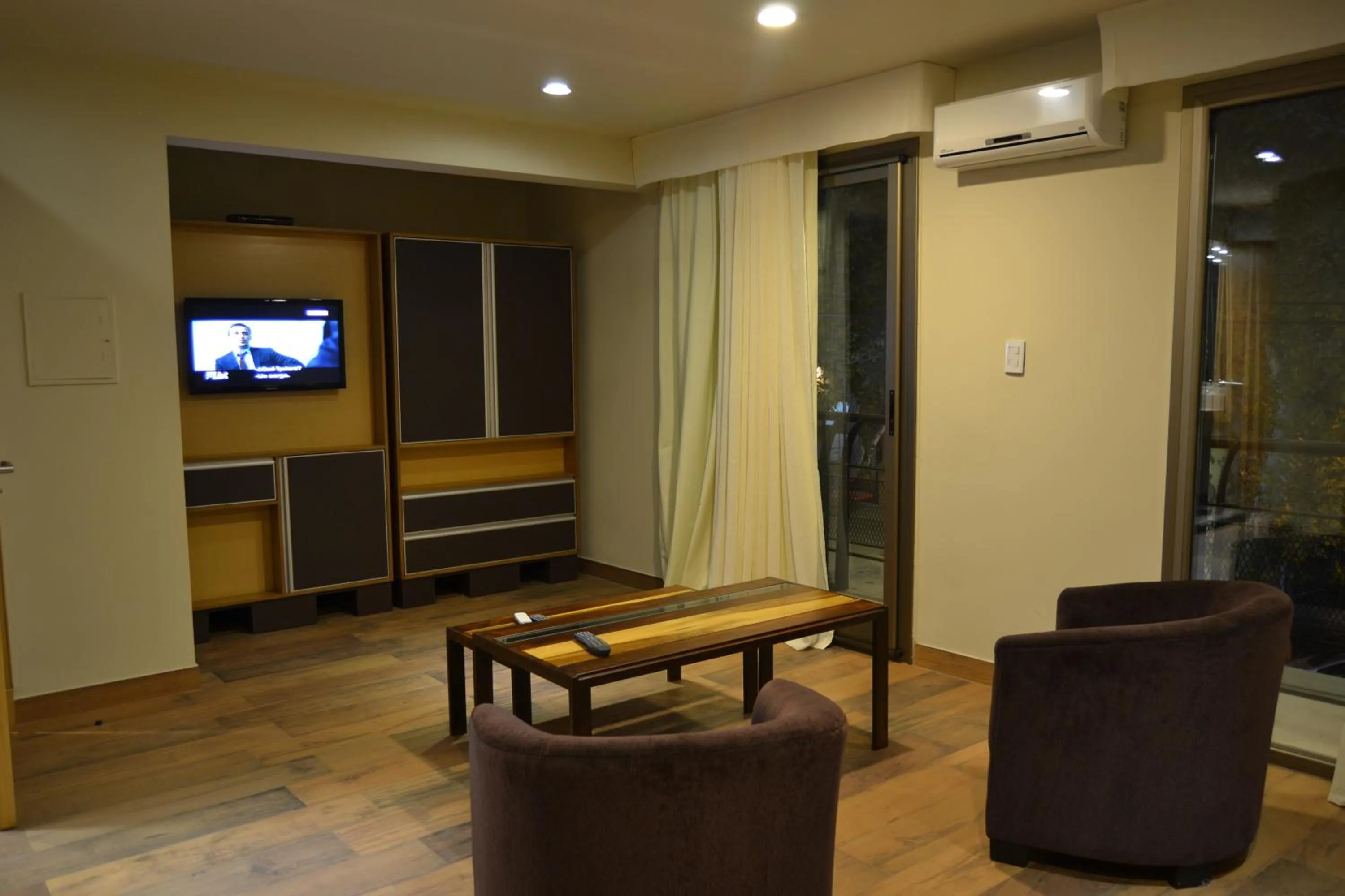 Communal lounge/ TV room in Plaza Paradiso Petit Hotel