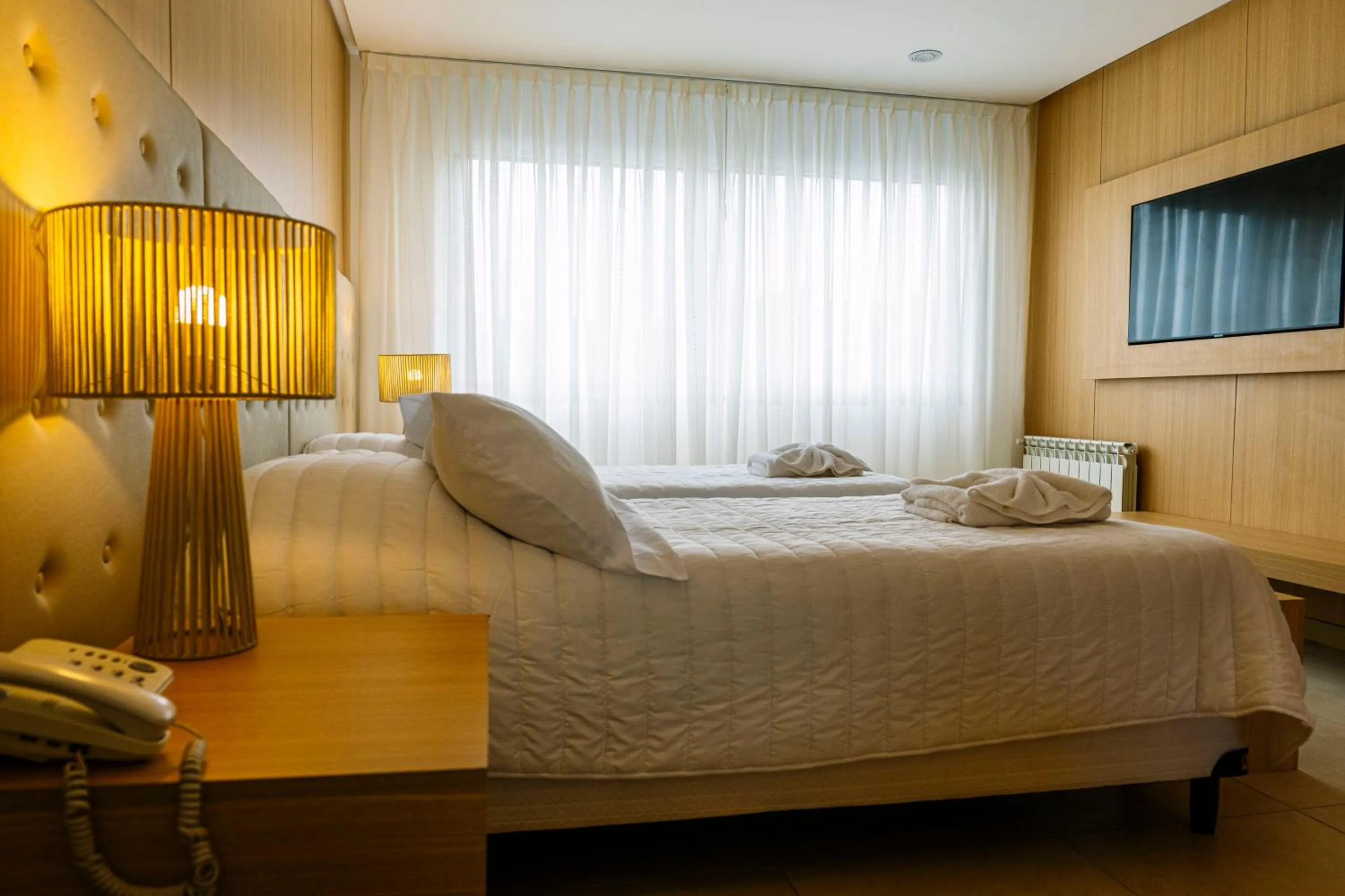 Bed in Plaza Paradiso Petit Hotel