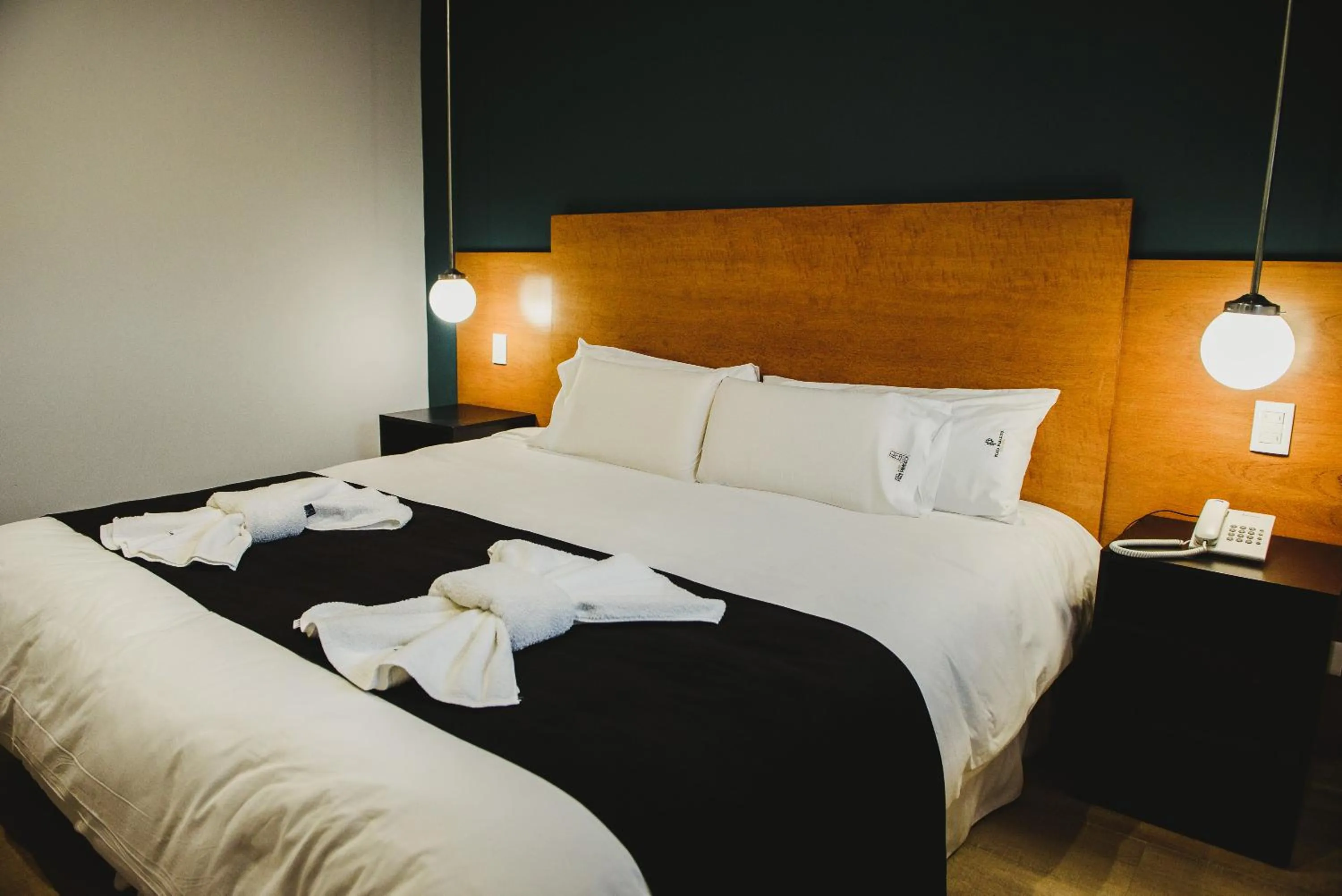 Bed in Plaza Paradiso Petit Hotel